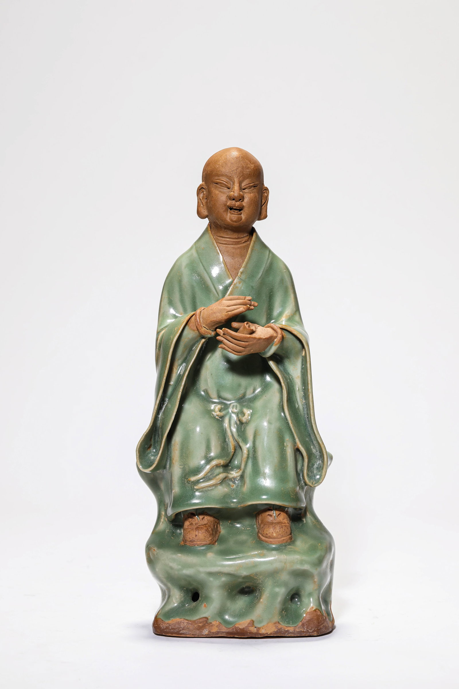 A LONGQUAN-TYPE FIGURE OF BUDDHA: A LONGQUAN-TYPE FIGURE OF BUDDHA Description: Dimensions: Length: 11.5 cm x Width: 8.1 cm x Height: 28.5 cm. All measurements are approximate.