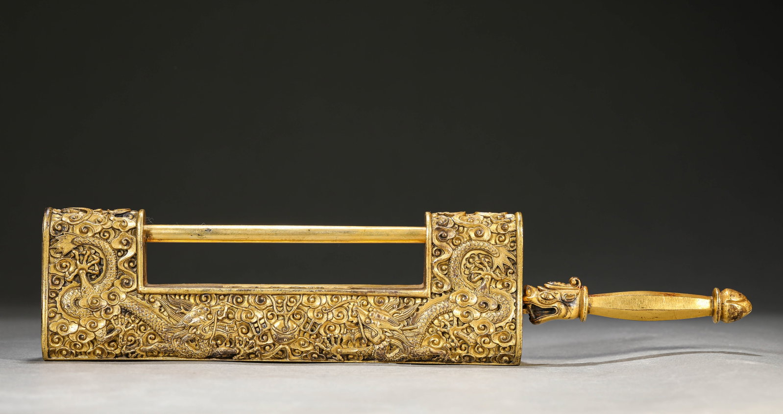 A GILT-BRONZE 'TWO DRAGONS CHASING A PEARL' PADLOCK (1 of 6)