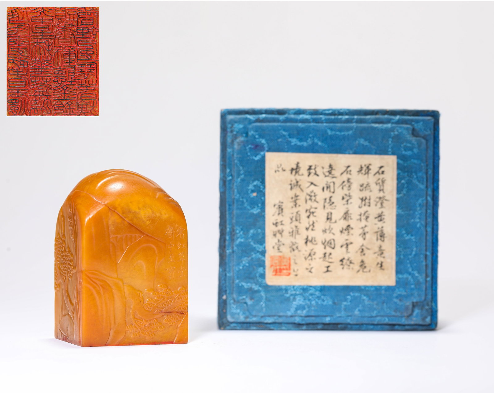 A TIANHUANG STONE 'CARVED NARRATIVE SCENE' SEAL: A TIANHUANG STONE 'CARVED NARRATIVE SCENE' SEAL Description: Dimensions: Length: 4.2 cm x Width: 3.6 cm x Height: 6.6 cm. All measurements are approximate.