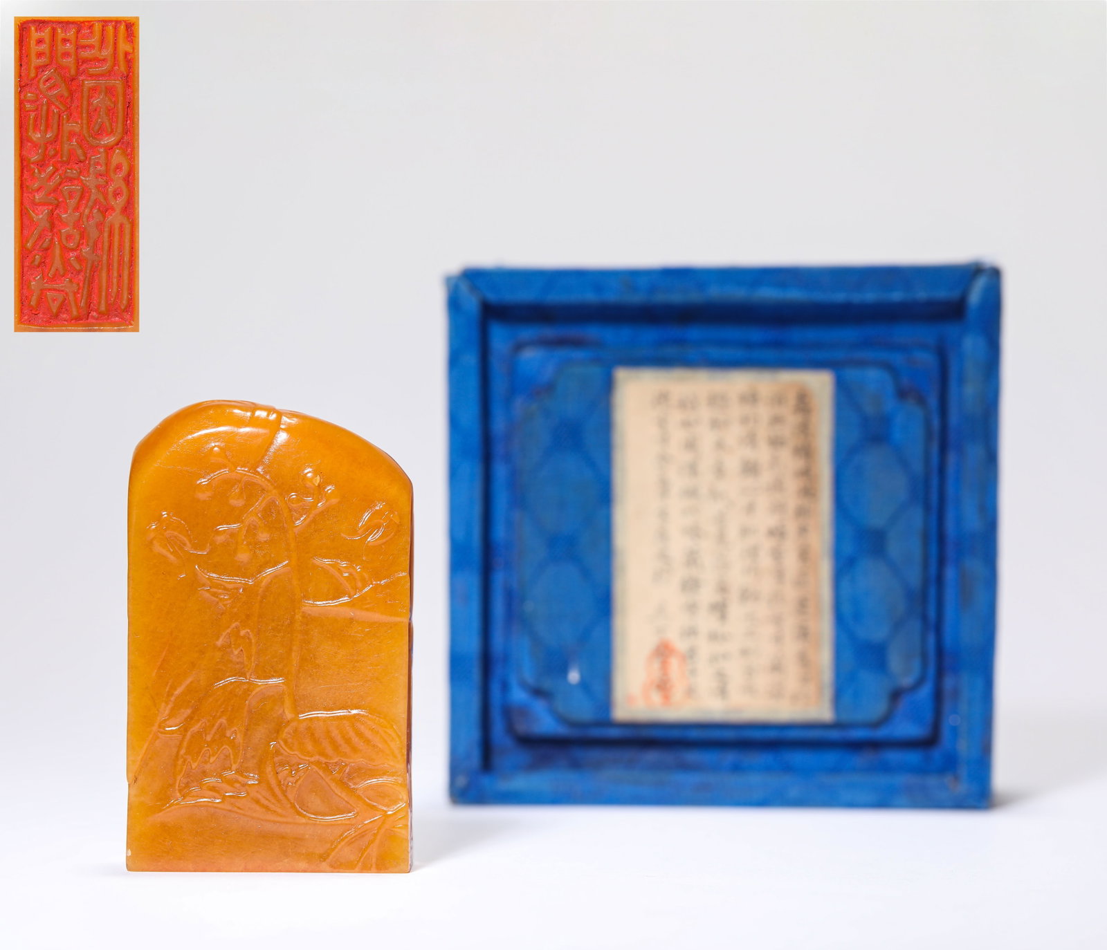 A TIANHUANG STONE 'BUTTERFLIES AMONG FLOWERS' SEAL: A TIANHUANG STONE 'BUTTERFLIES AMONG FLOWERS' SEAL Description: Dimensions: Length: 3.8 cm x Width: 1.7 cm x Height: 6.4 cm. All measurements are approximate.