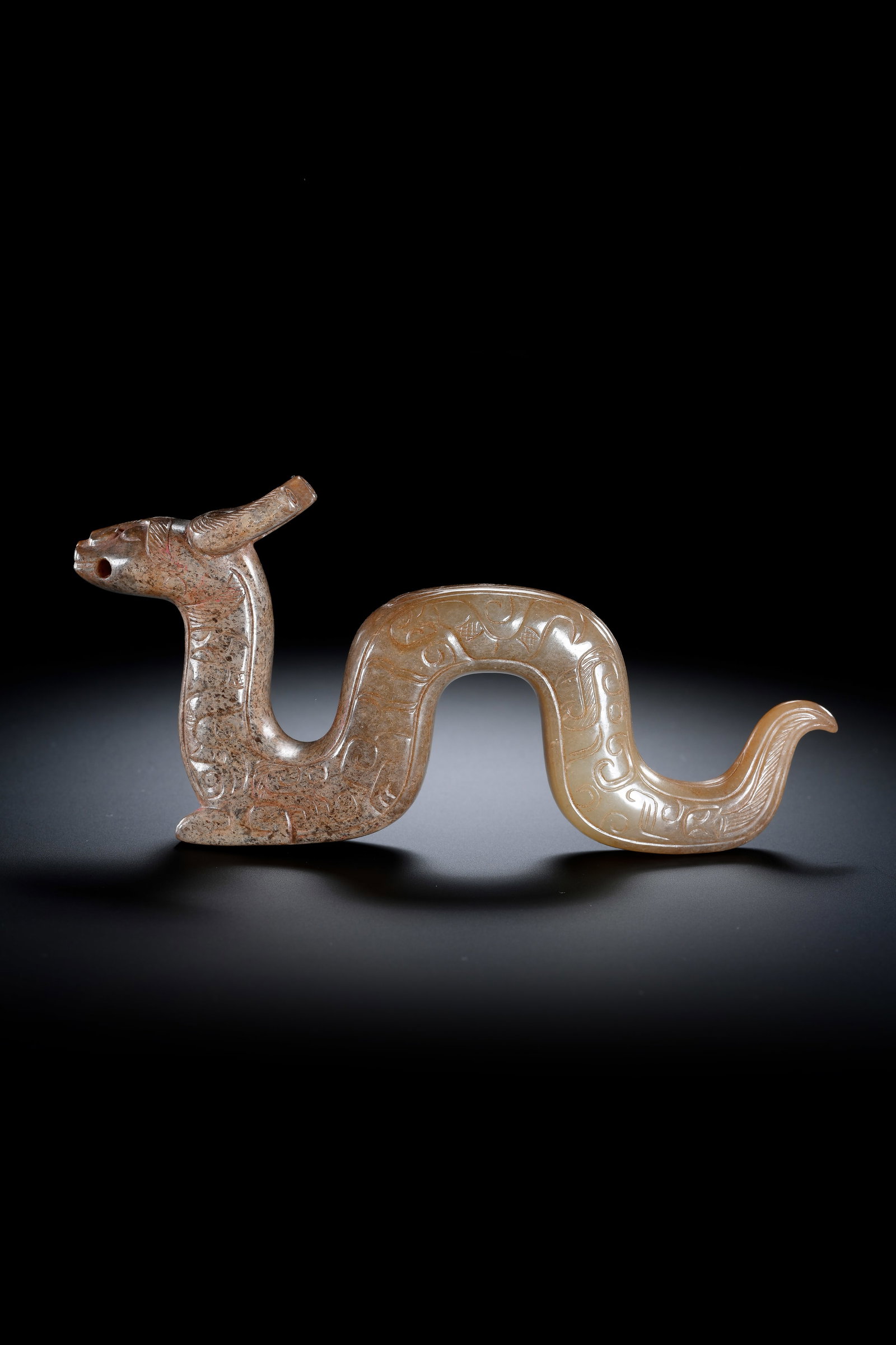 A JADE 'AUSPICIOUS BEAST': A JADE 'AUSPICIOUS BEAST' Description: Dimensions: Width: 14 cm x Height: 6.5 cm. All measurements are approximate.