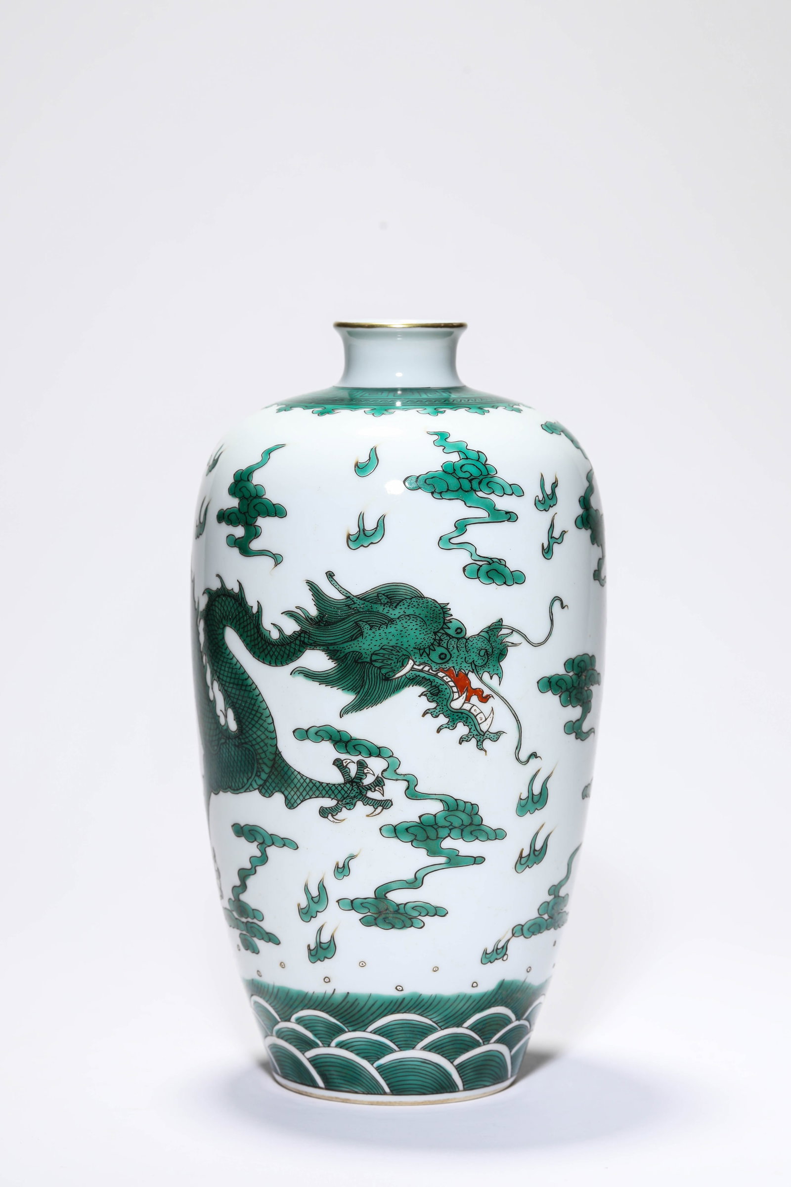 A GREEN-GLAZED 'DRAGON AMIDST WAVES AND CLOUDS? VASE: A GREEN-GLAZED 'DRAGON AMIDST WAVES AND CLOUDS? VASE Description: Dimensions: Width: 13.3 cm x Height: 24.7 cm. All measurements are approximate.