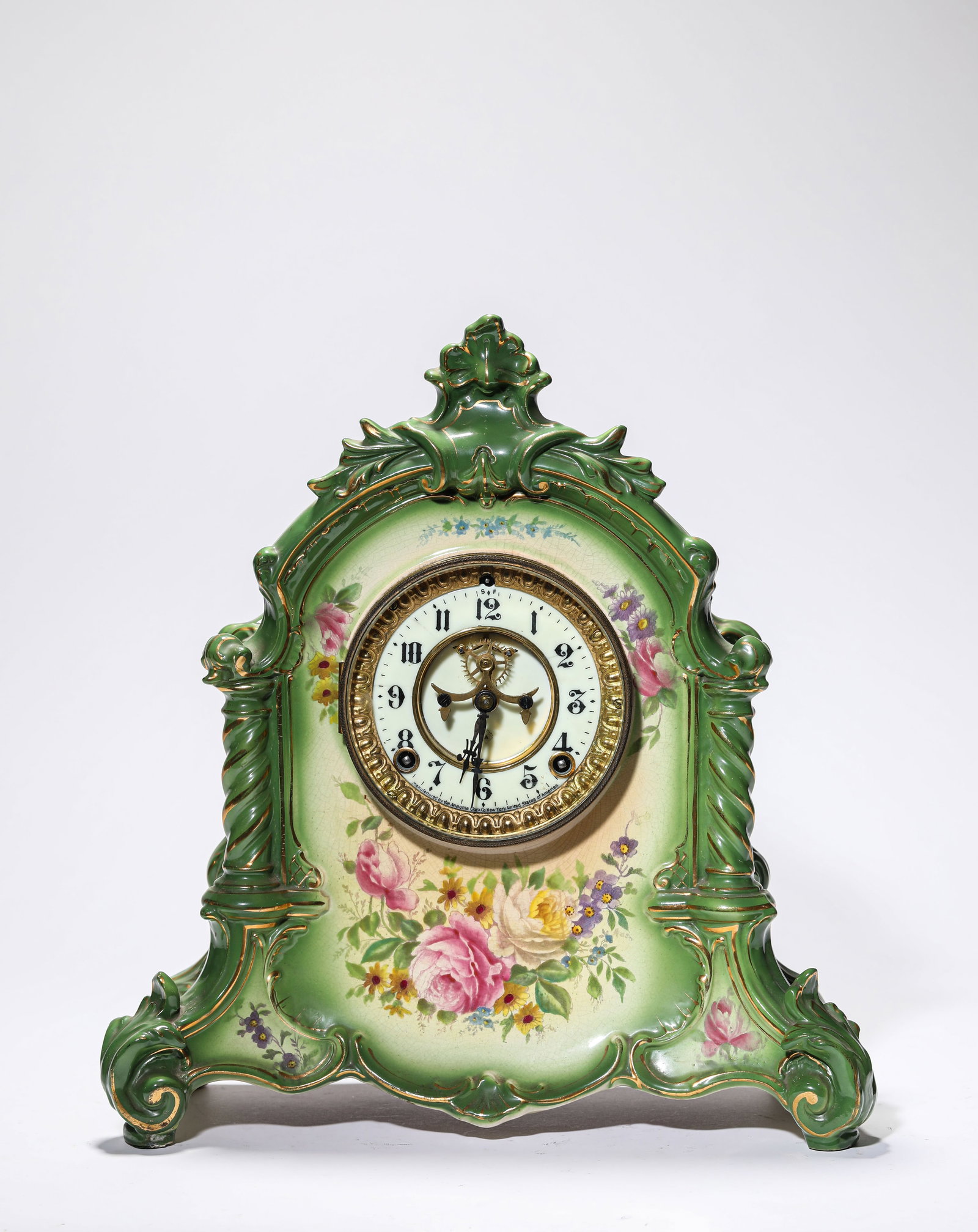 A PORCELAIN 'FLORAL' MANTEL CLOCK: A PORCELAIN 'FLORAL' MANTEL CLOCK Description: Dimensions: Length: 34 cm x Width: 15 cm x Height: 36.5 cm. All measurements are approximate.
