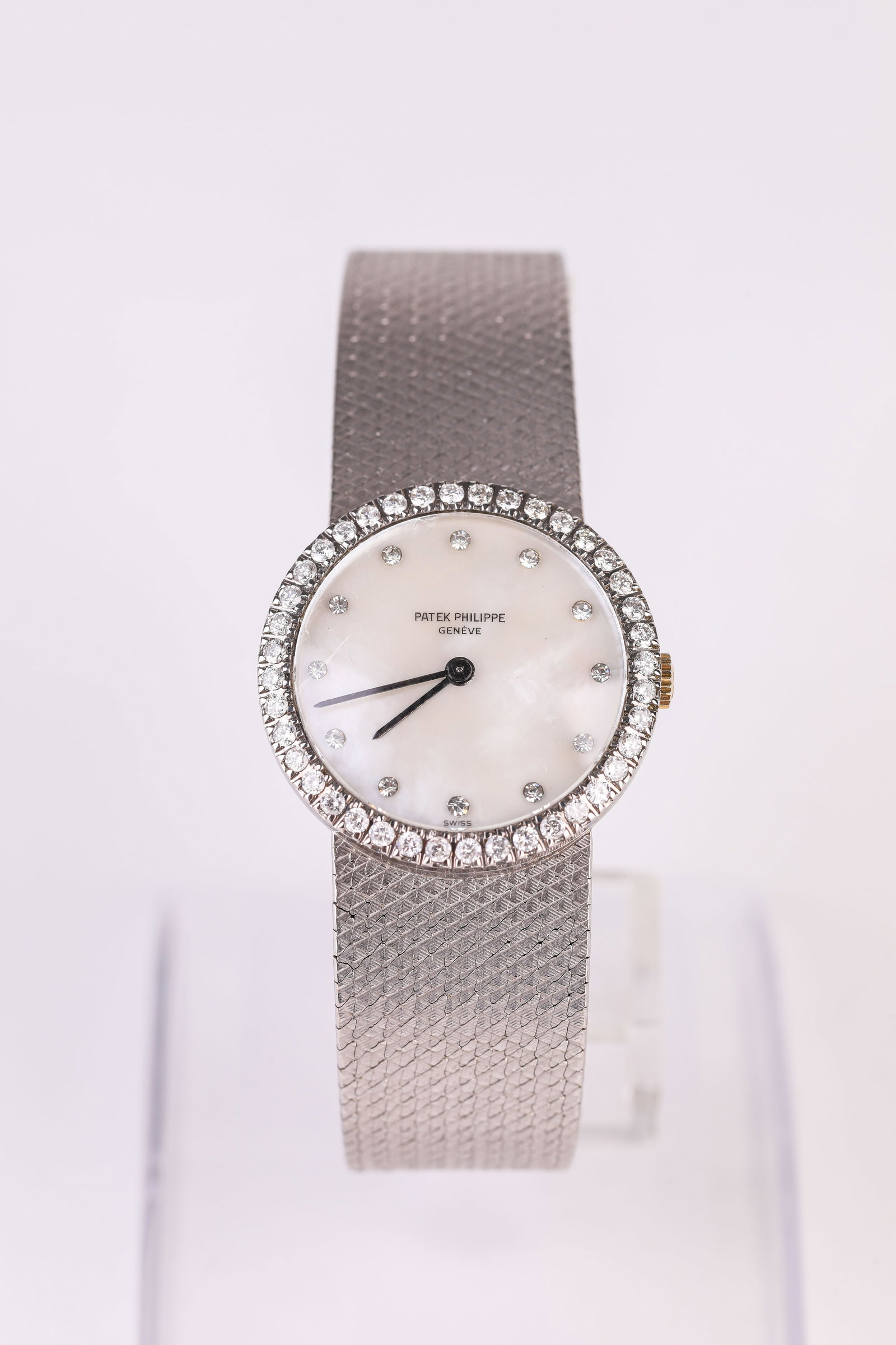 A PATEK PHILIPPE GOLD WRISTWATCH: A PATEK PHILIPPE GOLD WRISTWATCH Description: Dimensions: Width: 26 mm. All measurements are approximate.