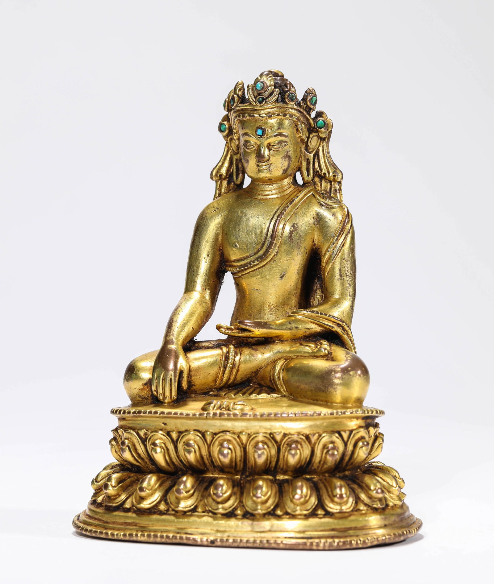 A GILT-BRONZE FIGURE OF AMITAYUS: A GILT-BRONZE FIGURE OF AMITAYUS Description: Dimensions: Weight: 928 g. Length: 10.3 cm x Width: 8 cm x Height: 13.7 cm. All measurements are approximate.