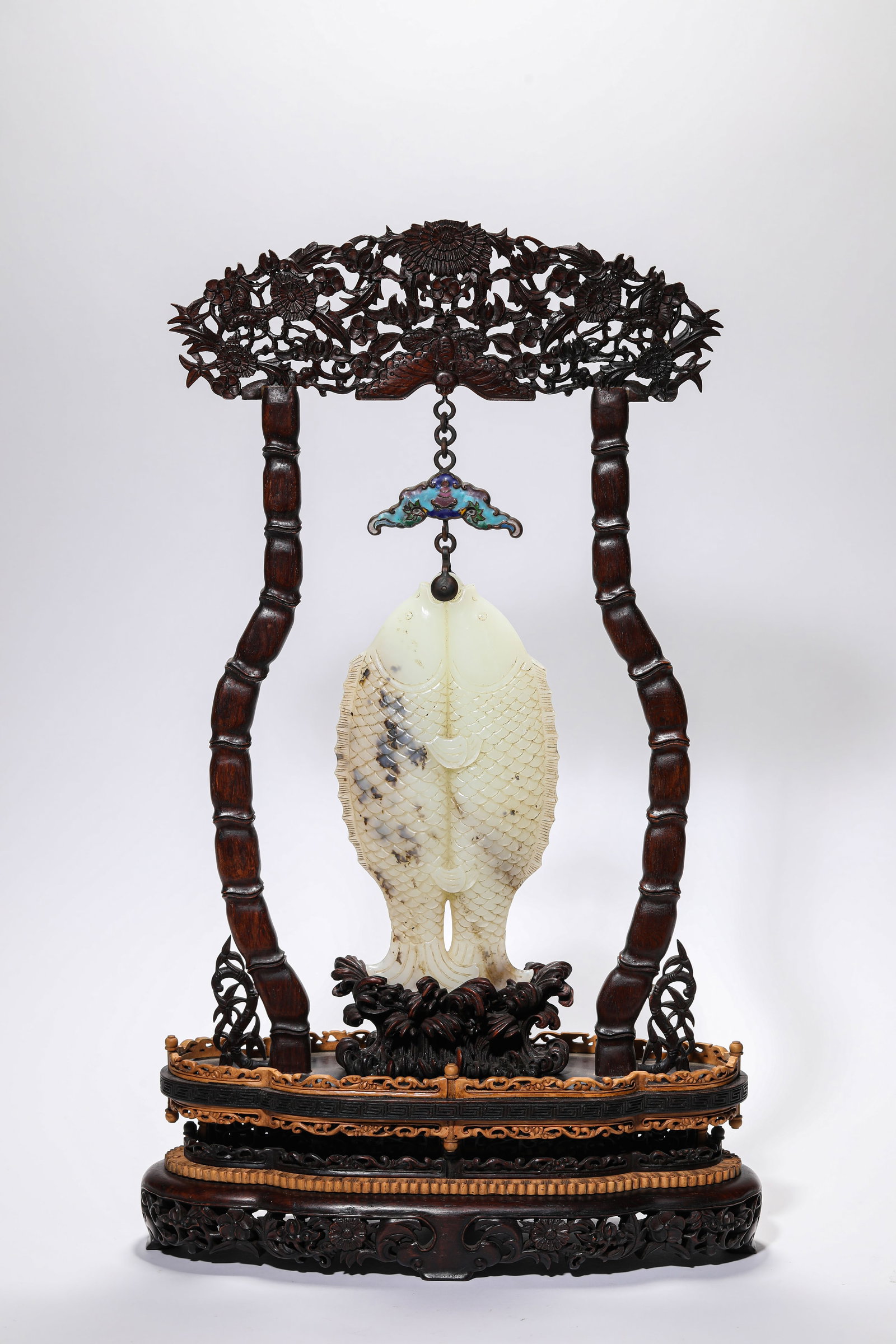 A JADE 'CARVED DOUBLE FISH' HANGING PANEL: A JADE 'CARVED DOUBLE FISH' HANGING PANEL Description: Dimensions: Length: 29.5 cm x Width: 11.2 cm x Height: 49.5 cm. All measurements are approximate.