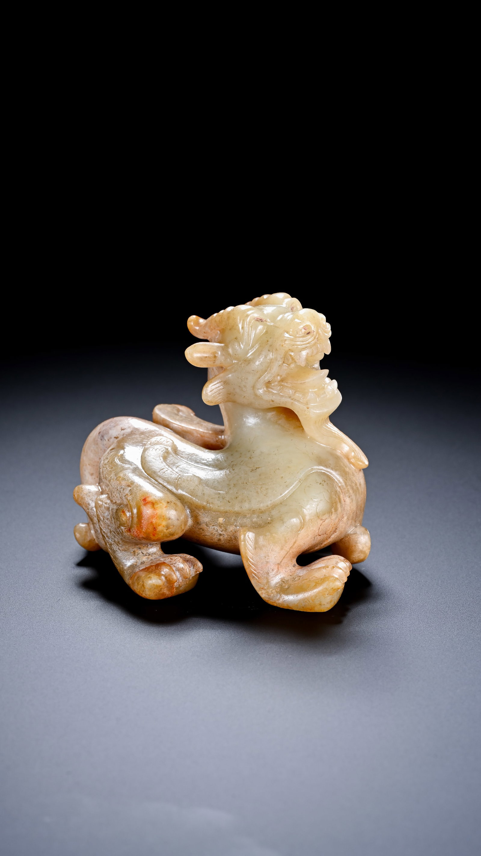 A JADE 'AUSPICIOUS BEAST': A JADE 'AUSPICIOUS BEAST' Description: Dimensions: Width: 6.1 cm x Height: 6 cm. All measurements are approximate.
