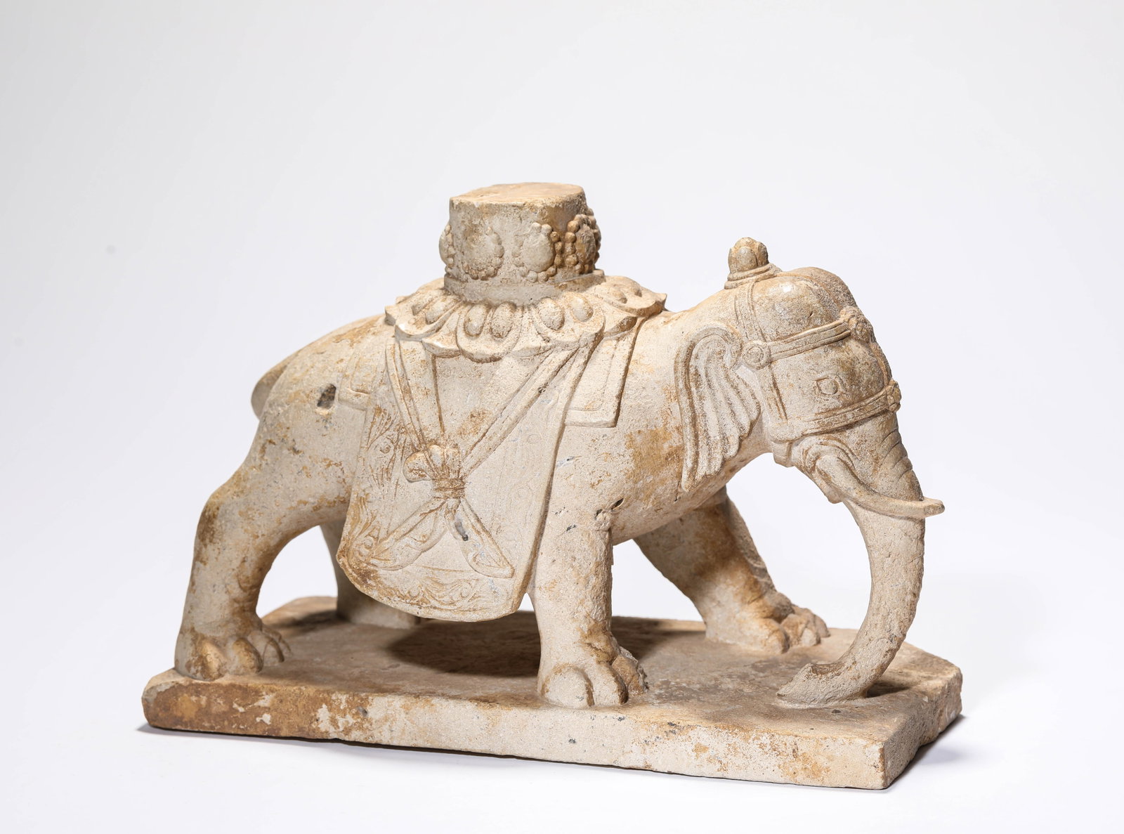 A STONE CARVING OF AN ELEPHANT: A STONE CARVING OF AN ELEPHANT Description: Dimensions: Length: 28 cm x Width: 13.8 cm x Height: 19.8 cm. All measurements are approximate.