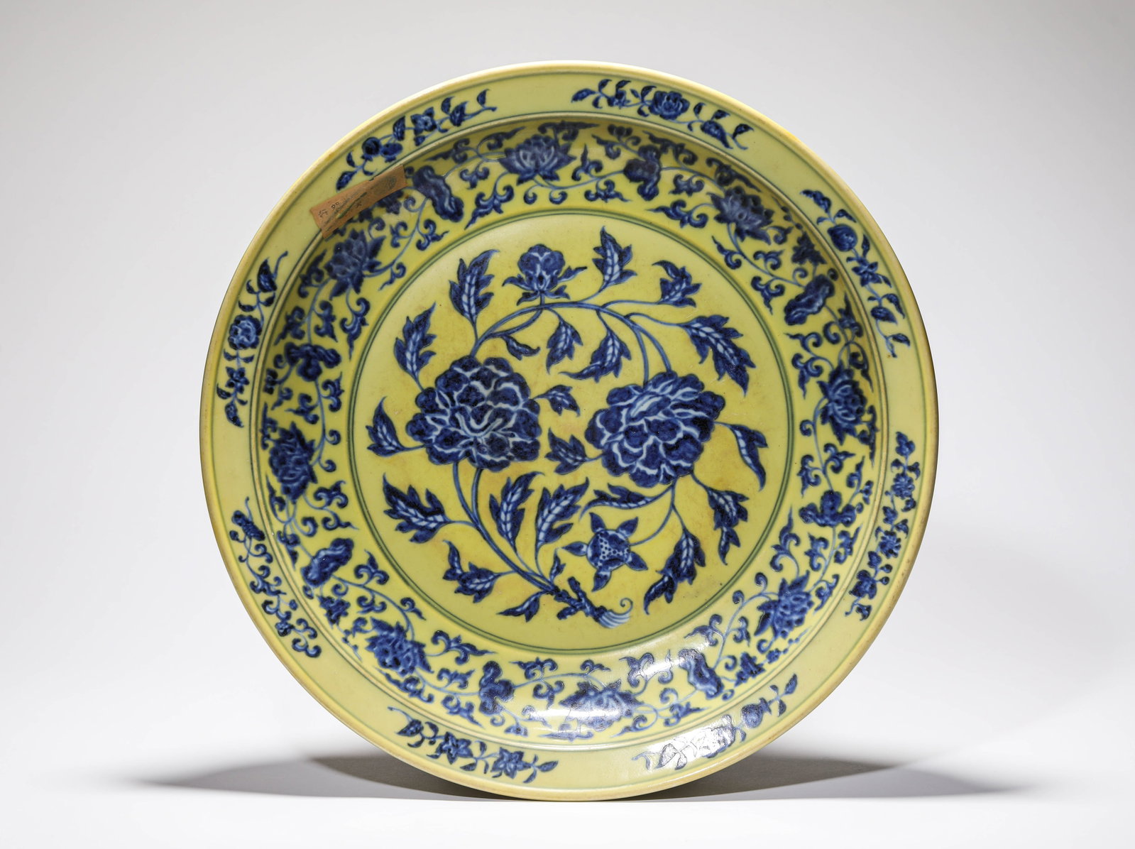 A YELLOW-GROUND BLUE AND WHITE 'FLORAL' DISH: A YELLOW-GROUND BLUE AND WHITE 'FLORAL' DISH Description: Dimensions: Width: 42.3 cm x Height: 6.9 cm. All measurements are approximate.