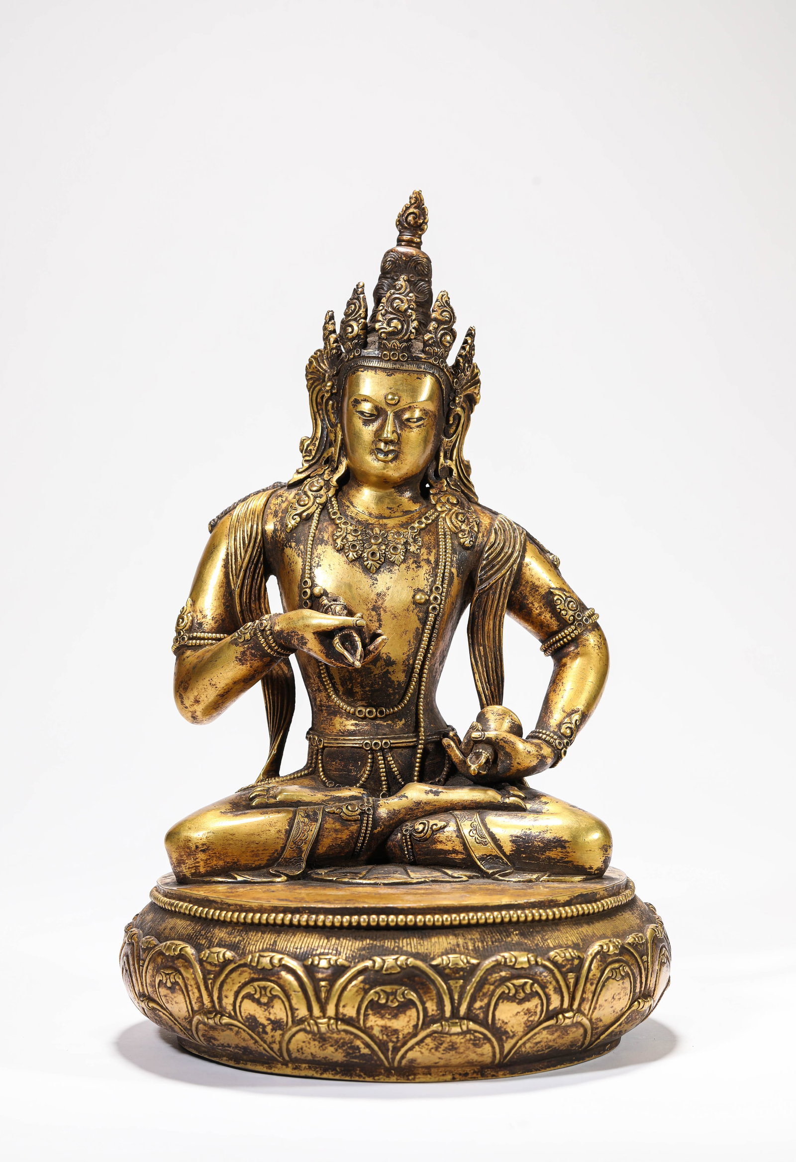 A GILT-BRONZE FIGURE OF VAJRASATTVA: A GILT-BRONZE FIGURE OF VAJRASATTVA Description: Dimensions: Weight: 6200 g. Width: 21 cm x Height: 33 cm. All measurements are approximate.