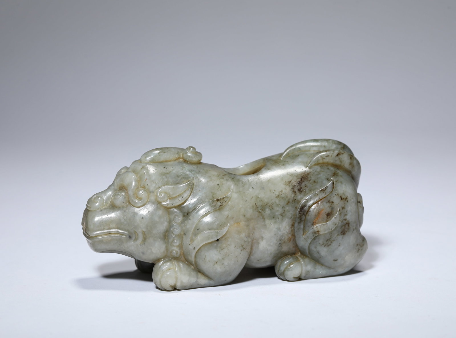 A JADE 'CARVED PIXIU' WATER POT: A JADE 'CARVED PIXIU' WATER POT Description: Dimensions: Length: 12.3 cm x Width: 5.2 cm x Height: 5.7 cm. All measurements are approximate.