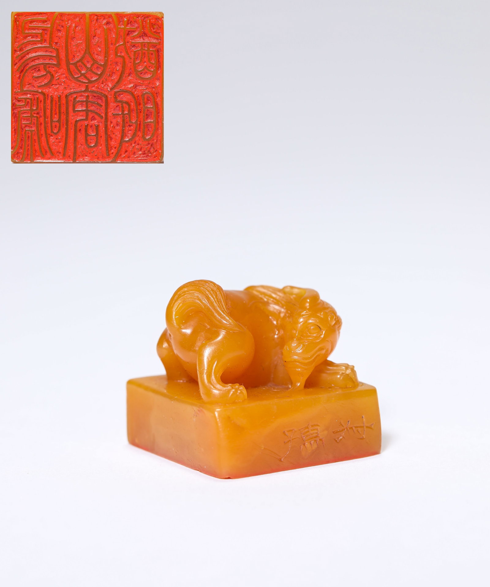A TIANHUANG STONE 'BEAST-FORM FINIAL' SEAL: A TIANHUANG STONE 'BEAST-FORM FINIAL' SEAL Description: Dimensions: Width: 2.5 cm x Height: 2.3 cm. All measurements are approximate.