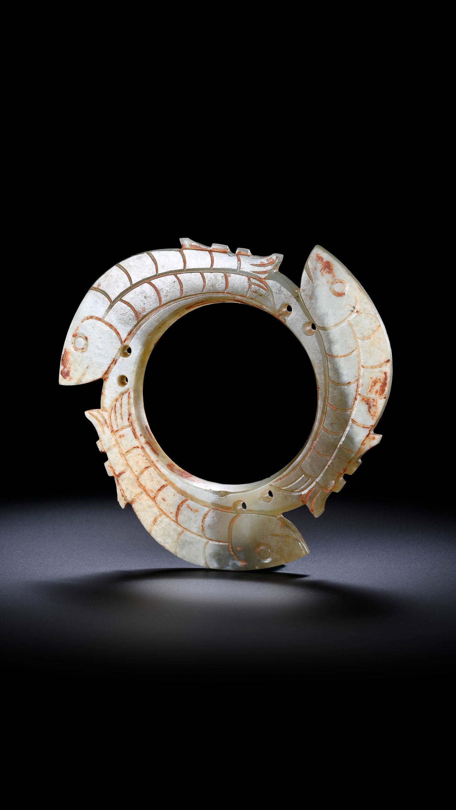 A JADE 'THREE FISH' RING PENDANT: A JADE 'THREE FISH' RING PENDANT Description: Dimensions: Width: 8.6 cm. All measurements are approximate.