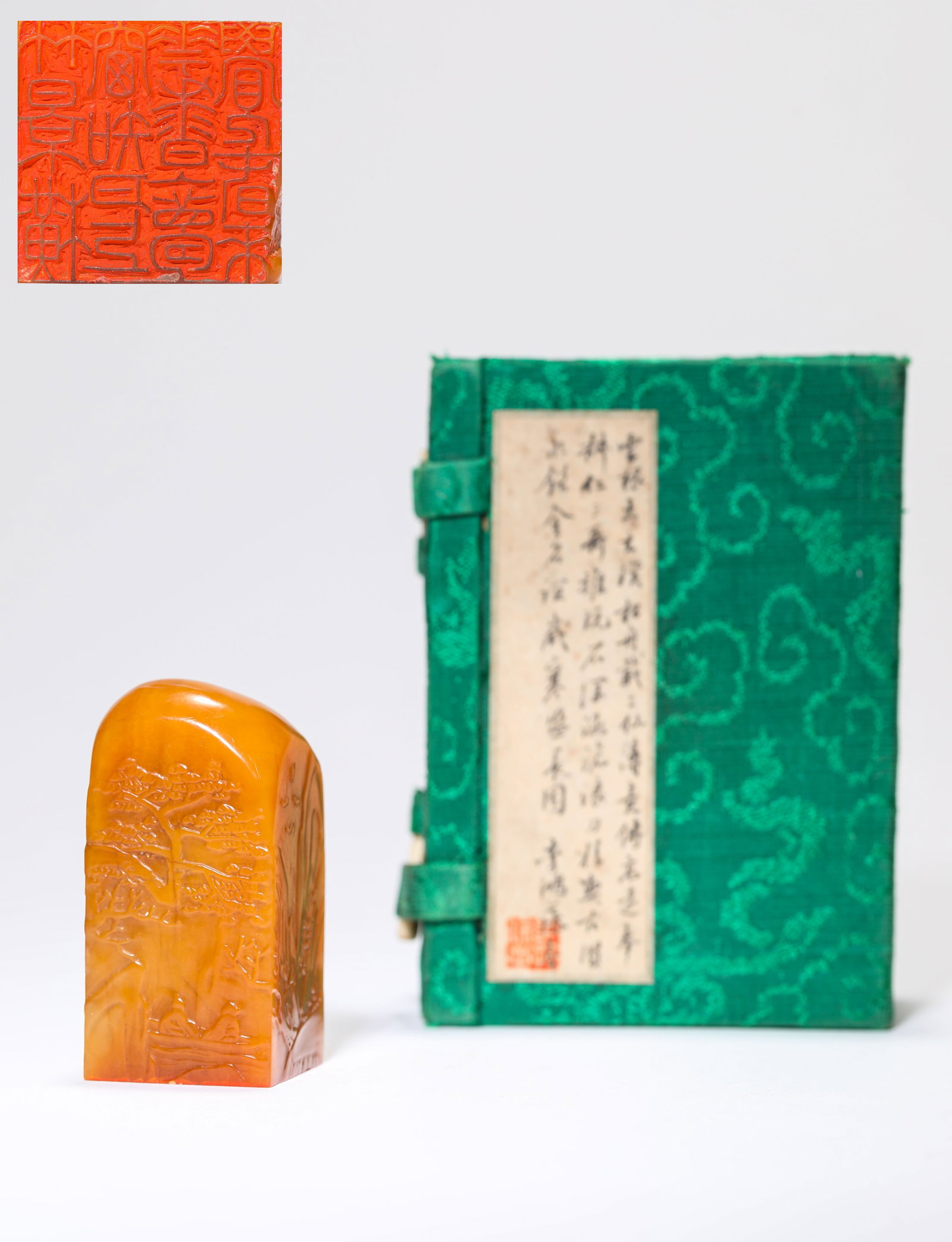 A TIANHUANG STONE 'CARVED SCHOLARS UNDER A PINE TREE' SEAL: A TIANHUANG STONE 'CARVED SCHOLARS UNDER A PINE TREE' SEAL Description: Dimensions: Length: 2.8 cm x Width: 2.7 cm x Height: 5.5 cm. All measurements are approximate.