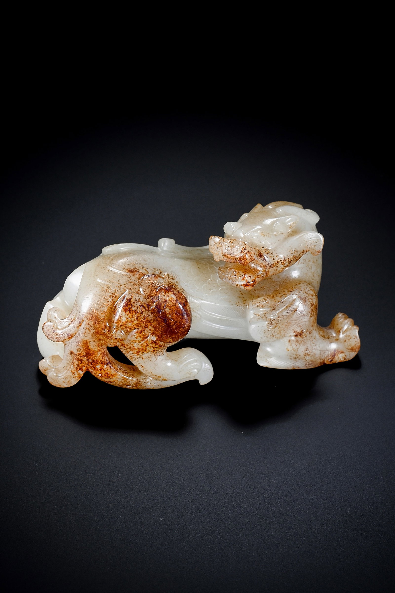 A JADE 'AUSPICIOUS BEAST': A JADE 'AUSPICIOUS BEAST' Description: Dimensions: Width: 10 cm x Height: 6 cm. All measurements are approximate.