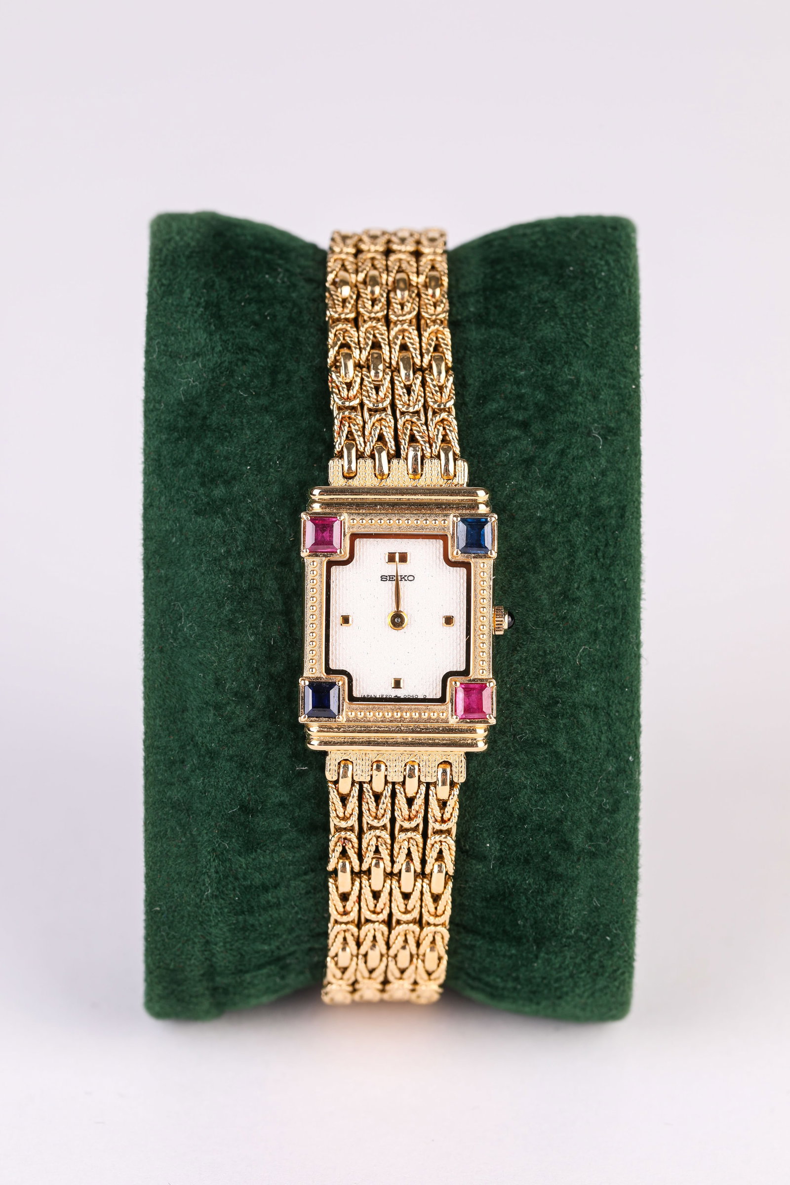 A SEIKO GOLD AND GEMSTONE WRISTWATCH: A SEIKO GOLD AND GEMSTONE WRISTWATCH Description: Dimensions: Width: 19 mm x Height: 23 mm. All measurements are approximate.