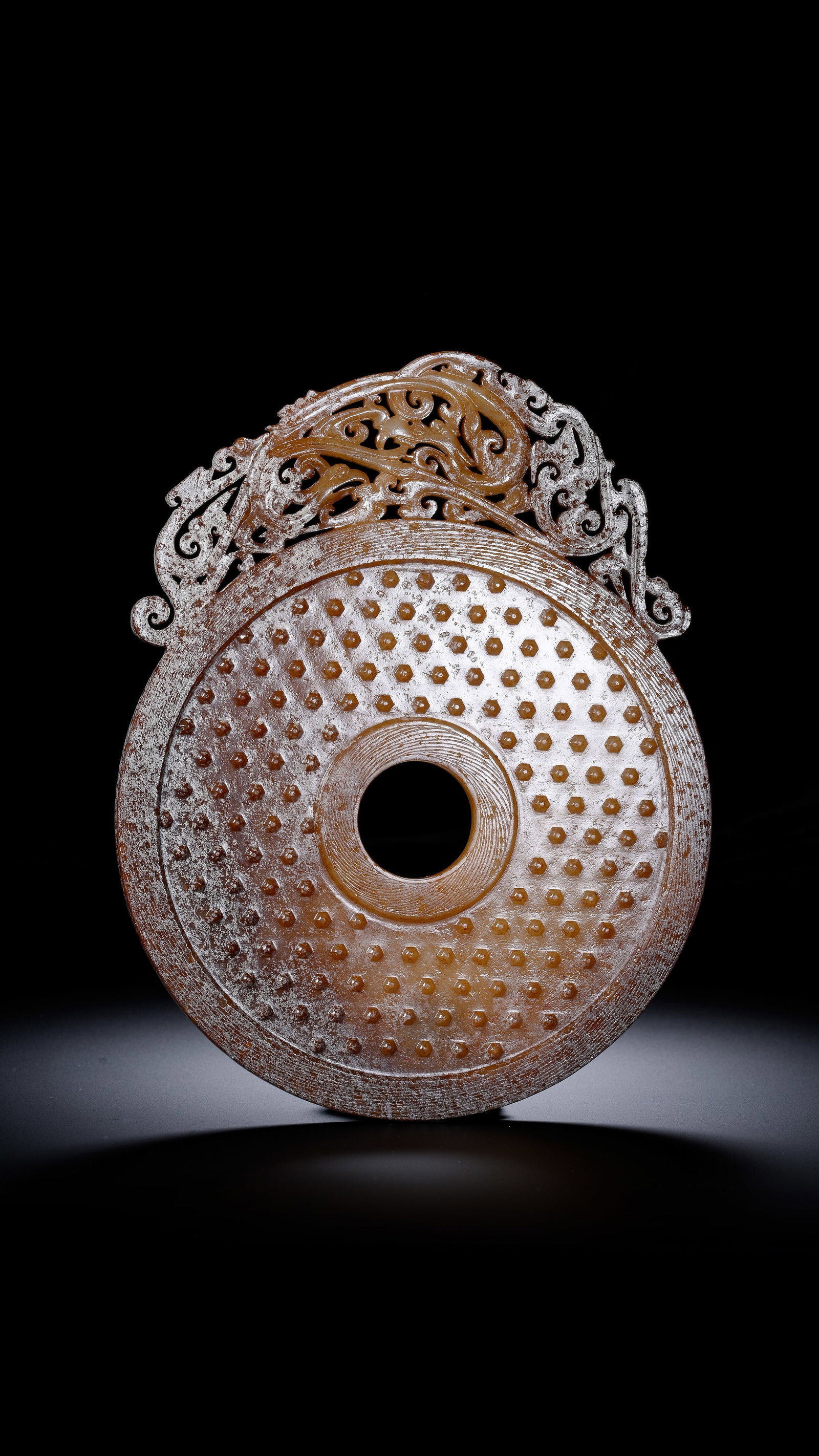 A JADE 'OPENWORK DRAGON AND PHOENIX' BI DISC: A JADE 'OPENWORK DRAGON AND PHOENIX' BI DISC Description: Dimensions: Width: 13.5 cm x Height: 17 cm. All measurements are approximate.