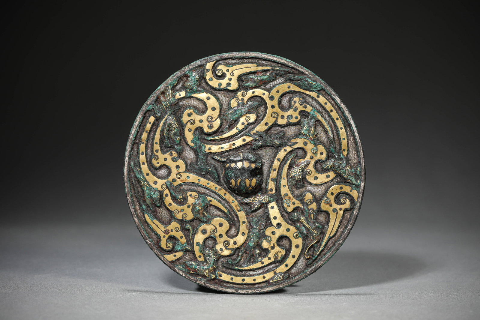 A GOLD AND SILVER-INLAID BRONZE 'DRAGON' MIRROR (1 of 4)