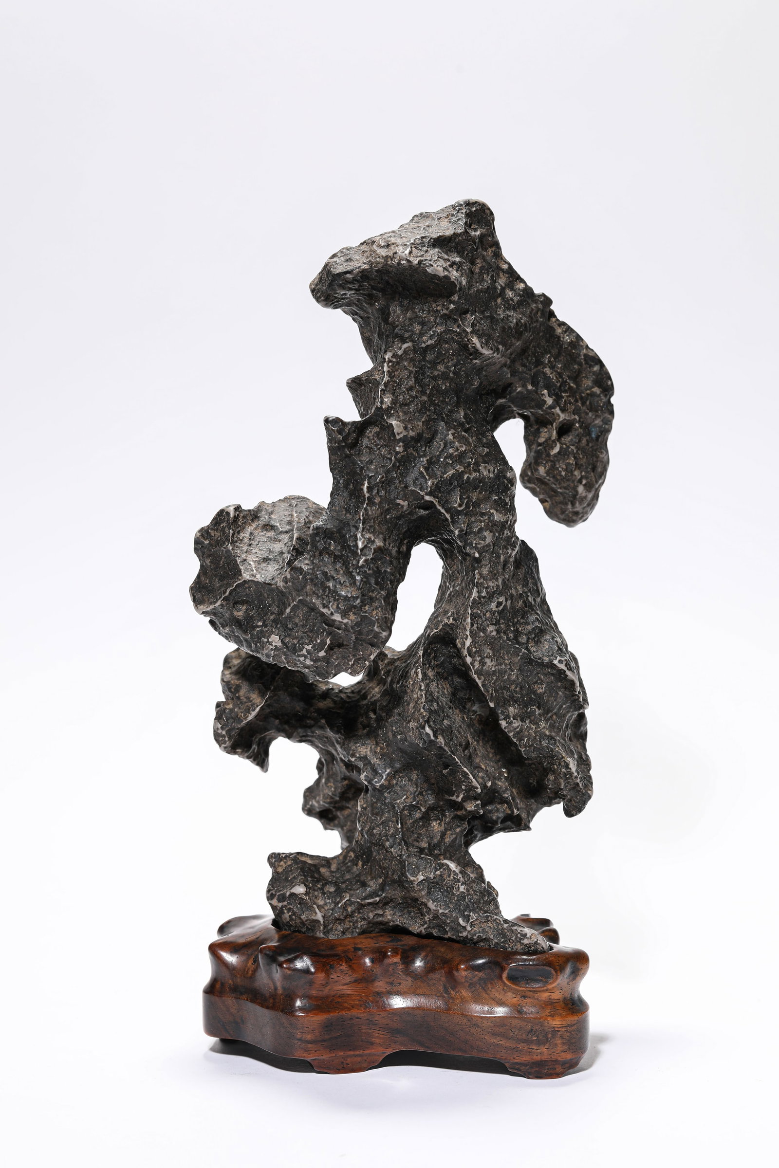 A LINGBI STONE 'MOUNTAIN' ORNAMENT: A LINGBI STONE 'MOUNTAIN' ORNAMENT Description: Dimensions: Length: 12.5 cm x Width: 10.2 cm x Height: 28 cm. All measurements are approximate.