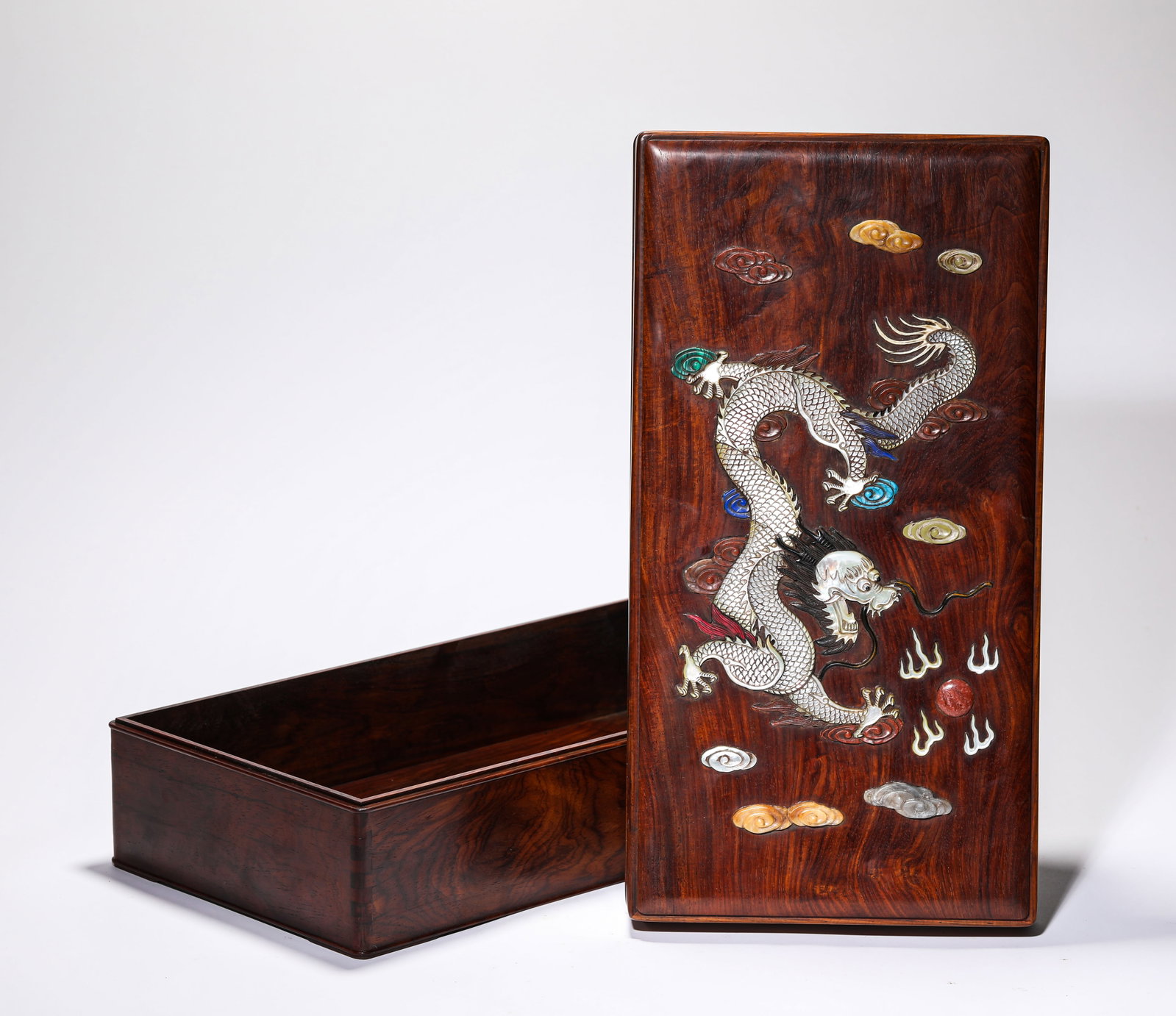 A WOOD AND 'HUNDRED TREASURES'-INLAID 'DRAGON' COVERED BOX: A WOOD AND 'HUNDRED TREASURES'-INLAID 'DRAGON' COVERED BOX Description: Dimensions: Length: 40 cm x Width: 21 cm x Height: 12 cm. All measurements are approximate.