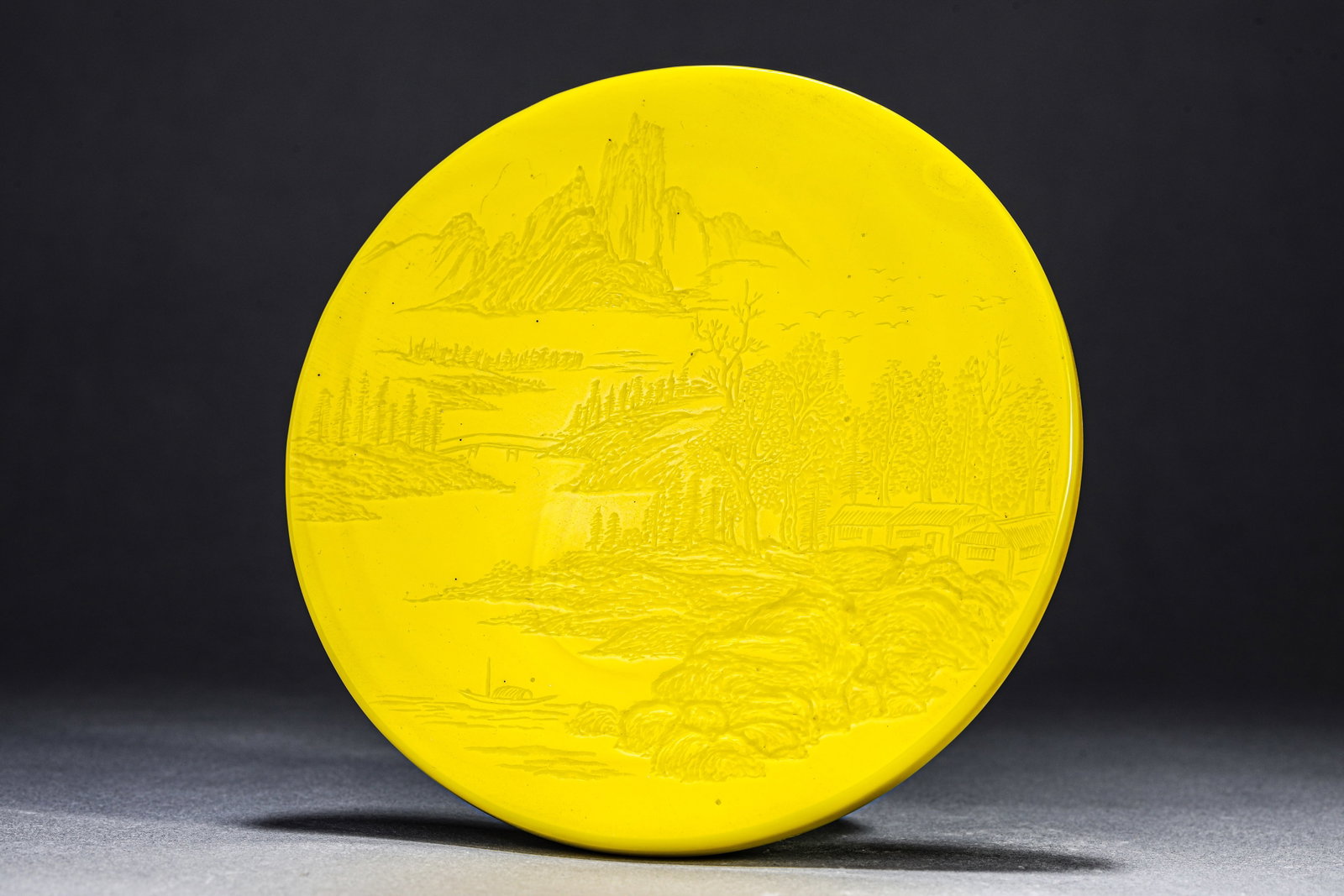 A YELLOW-GLASS 'LANDSCAPE AND POEM' PLAQUE: A YELLOW-GLASS 'LANDSCAPE AND POEM' PLAQUE Description: Dimensions: Width: 15.6 cm. All measurements are approximate.