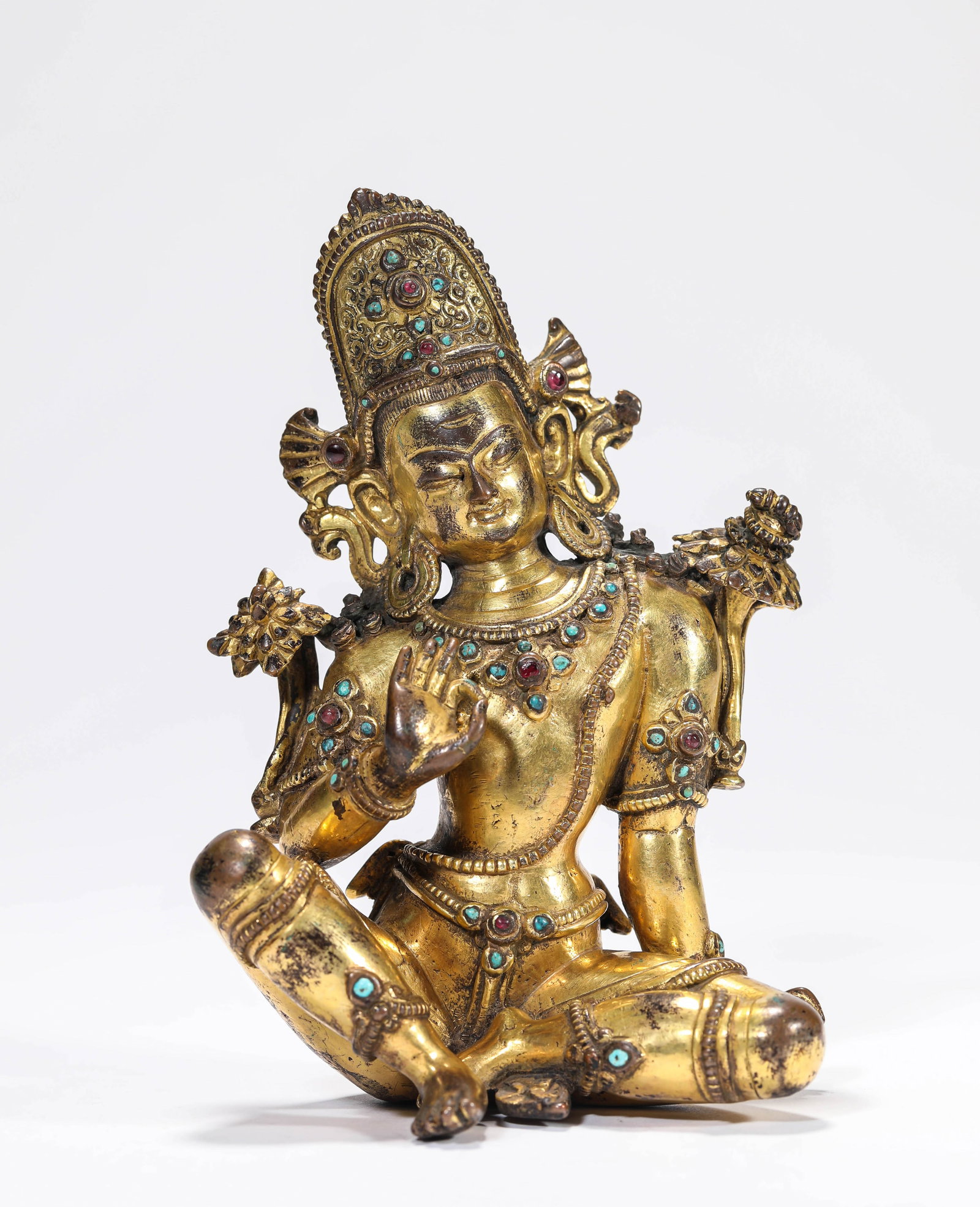 A GILT-BRONZE 'WATER-MOON' FIGURE OF AVALOKITESHVARA: A GILT-BRONZE 'WATER-MOON' FIGURE OF AVALOKITESHVARA Description: Dimensions: Weight: 647 g. Length: 8.8 cm x Width: 5.9 cm x Height: 13.5 cm. All measurements are approximate.