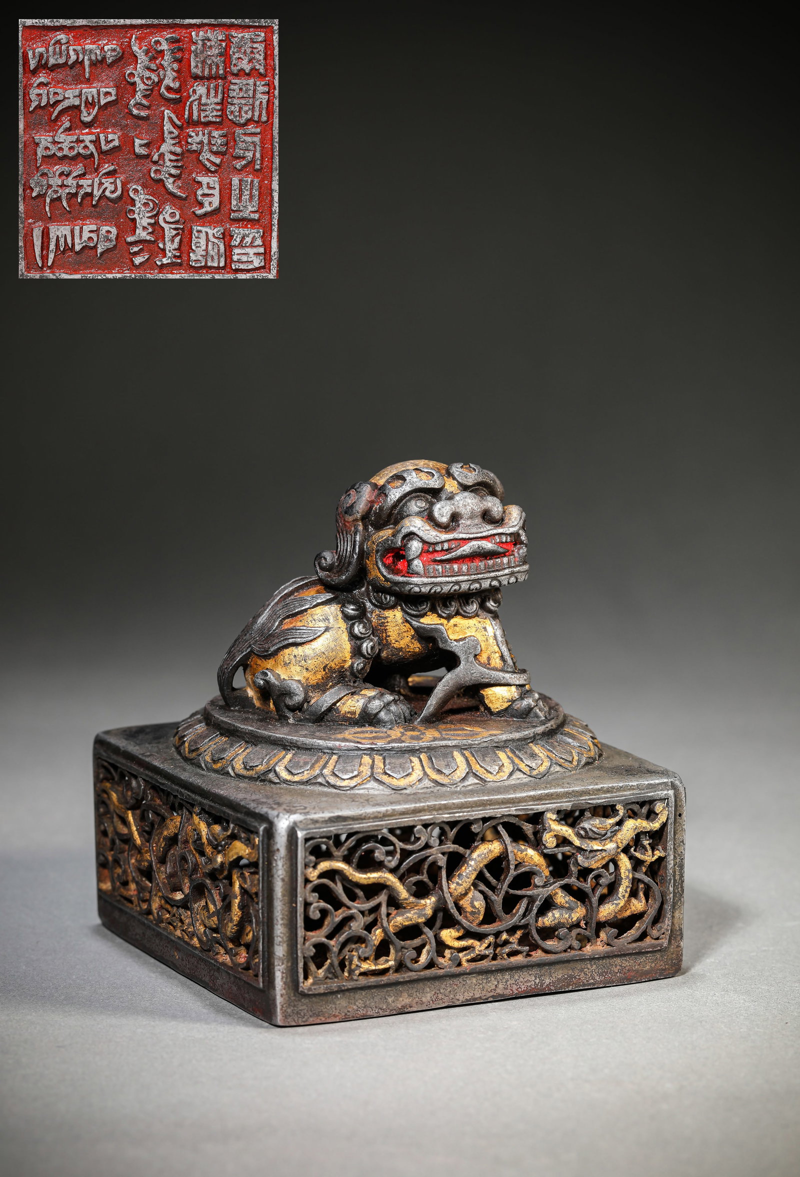 A TIBETAN IRON AND GOLD CHAMPLEVE 'OPENWORK' 'SNOW LION TEMPLE' SEAL: A TIBETAN IRON AND GOLD CHAMPLEVE 'OPENWORK' 'SNOW LION TEMPLE' SEAL Description: Dimensions: Weight: 1744 g. Width: 10.7 cm x Height: 11.4 cm. All measurements are approximate.