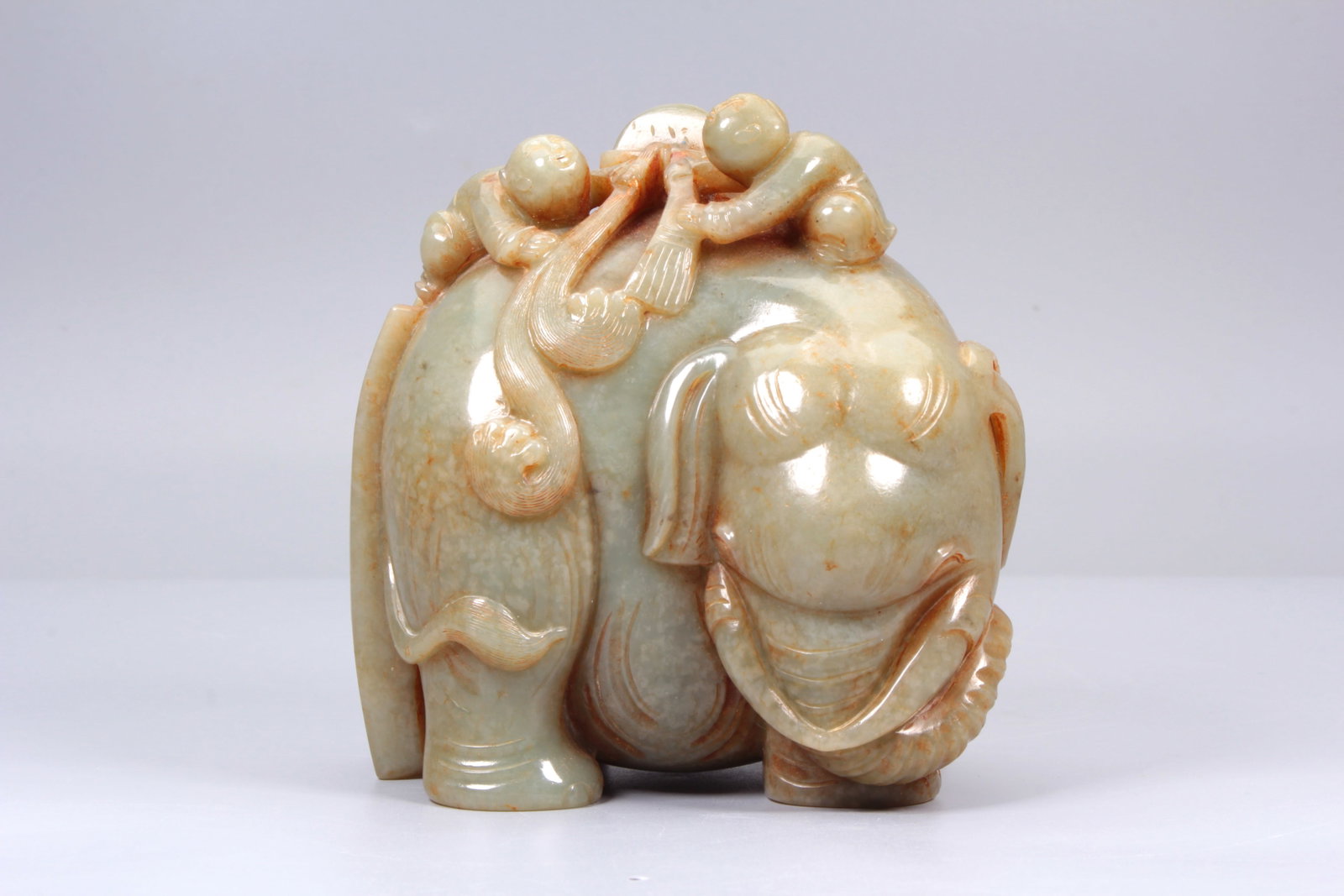 A CARVED HETIAN JADE ORNAMENT OF ELEPHANT WASHING (1 of 8)