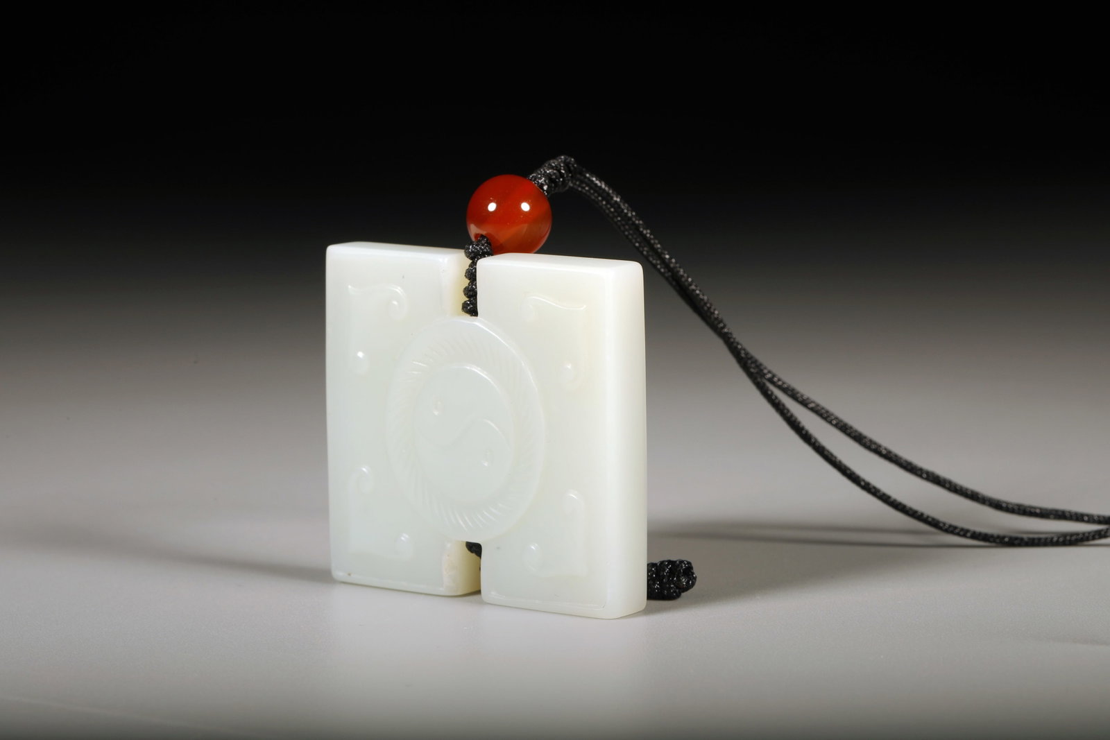 A WHITE JADE 'EIGHT TRIGRAMS' PENDANT - 7