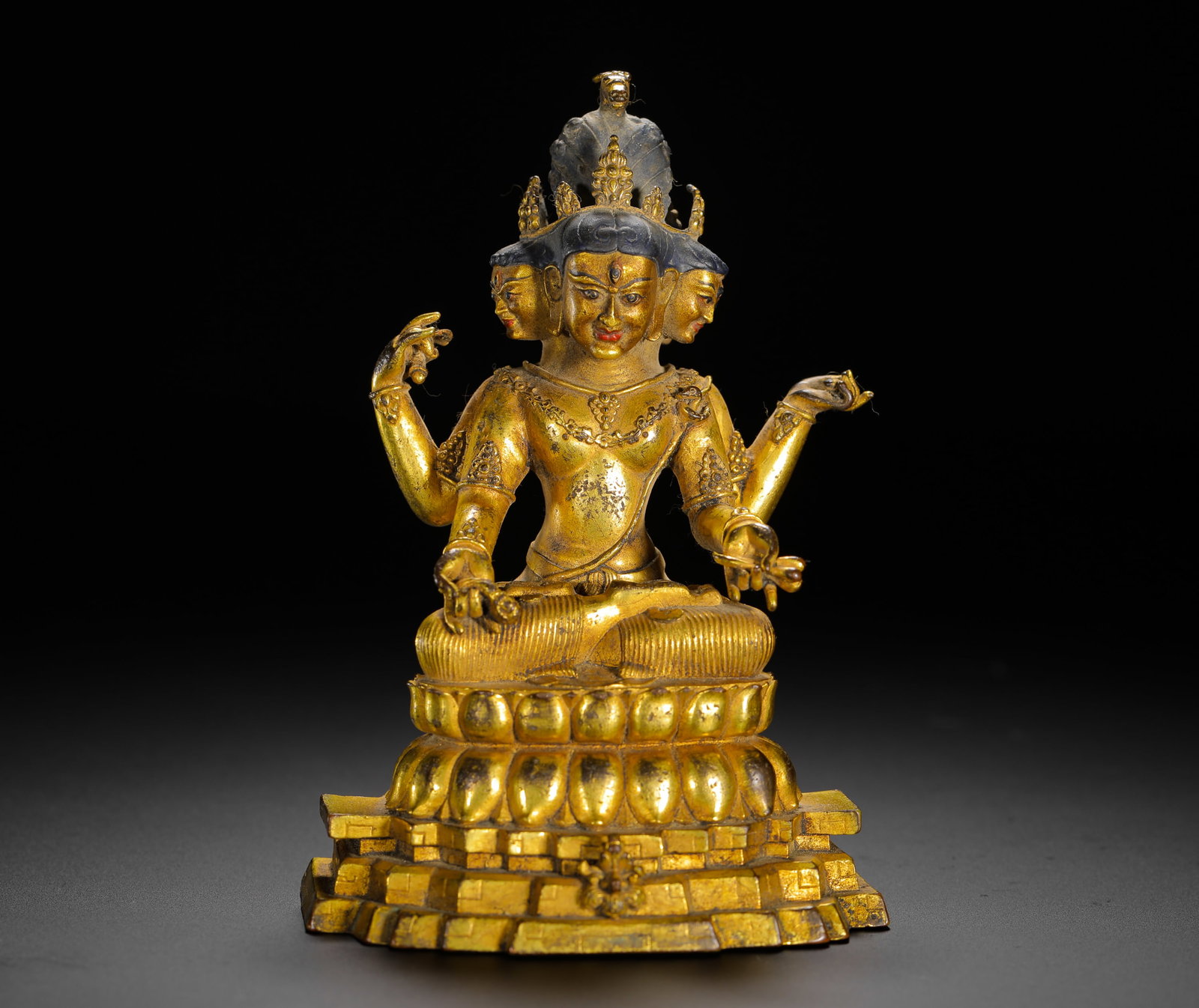 GILDED BRONZE FOUR-FACED EIGHT-ARMED VONGSHENG BUDDHA MOTHER SITTING FIGURE: GILDED BRONZE FOUR-FACED EIGHT-ARMED VONGSHENG BUDDHA MOTHER SITTING FIGURE (12.3 x 7.9cm,Weight:420g)