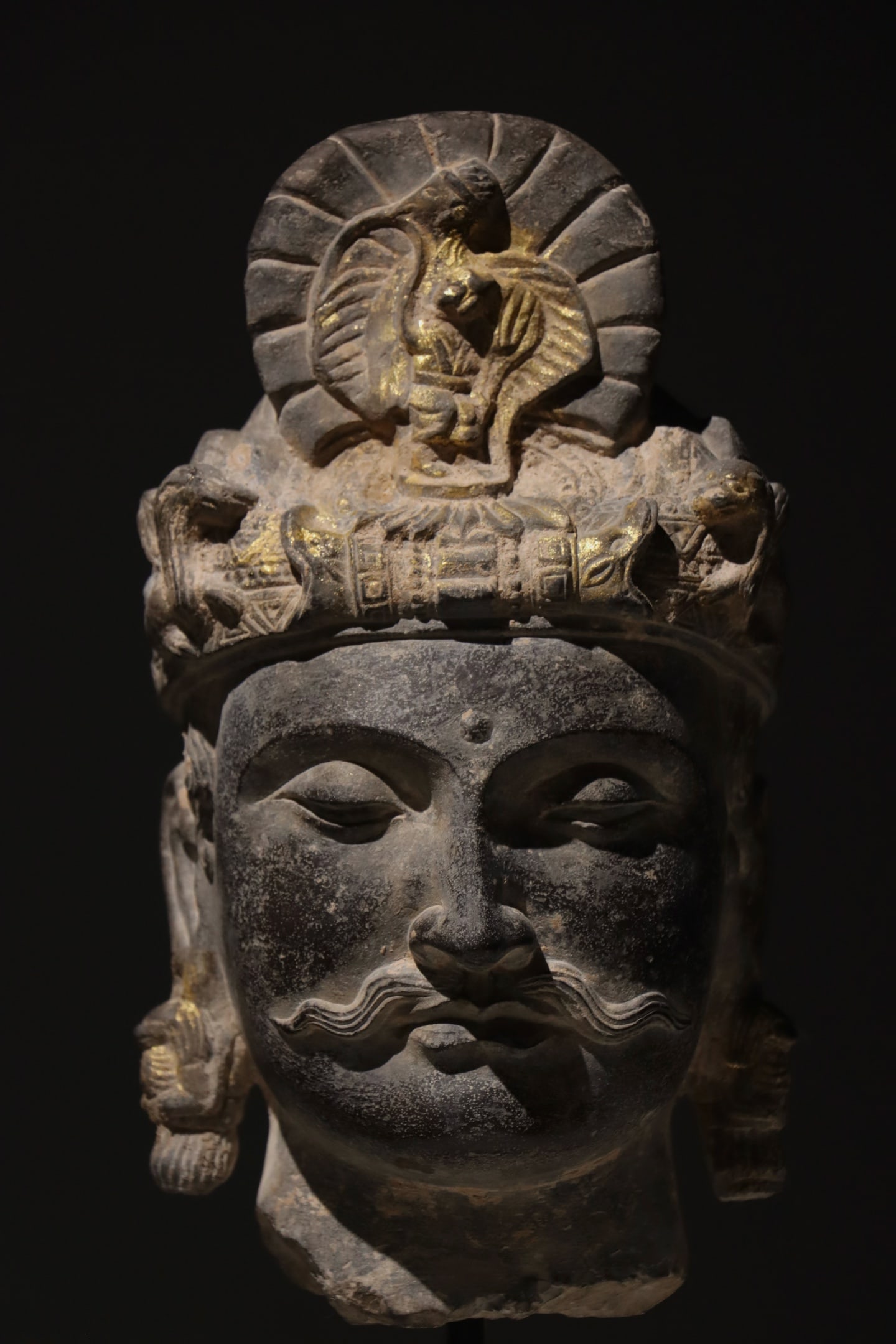 A GANDHARA BUDDHA HEAD FROM THE 3RD CENTURY: A GANDHARA BUDDHA HEAD FROM THE 3RD CENTURY (55 x 33cm)