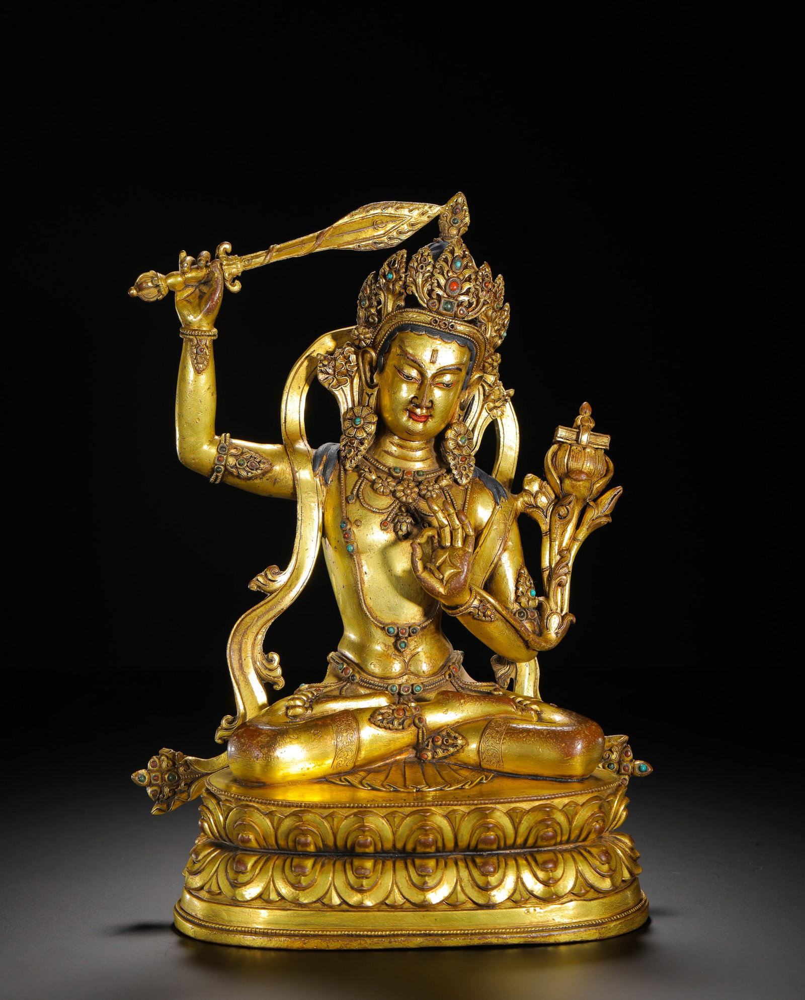 A GILDED BRONZE STATUE OF MANJUSRI BODHISATTVA WITH GEMSTONES: A GILDED BRONZE STATUE OF MANJUSRI BODHISATTVA WITH GEMSTONES (27 x 20cm,Weight:2750g)