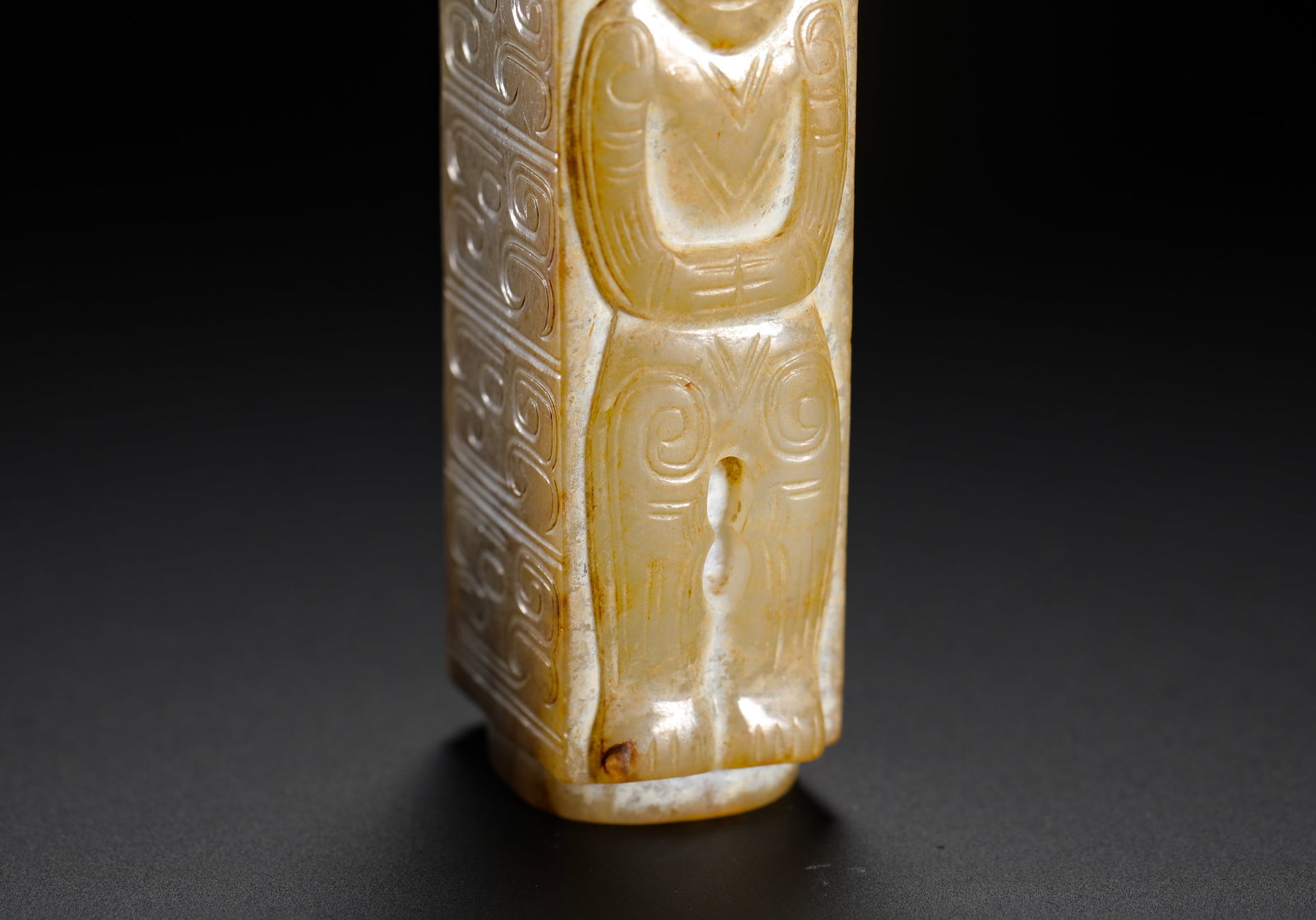 A JADE FIGURE WITH A PATTERNED LEZI - 2