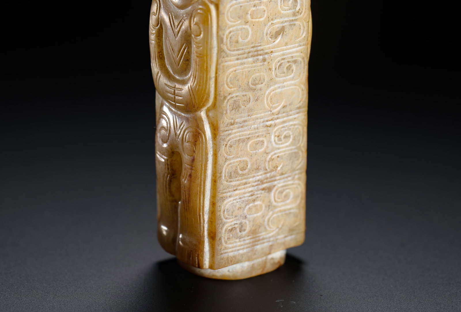 A JADE FIGURE WITH A PATTERNED LEZI - 5