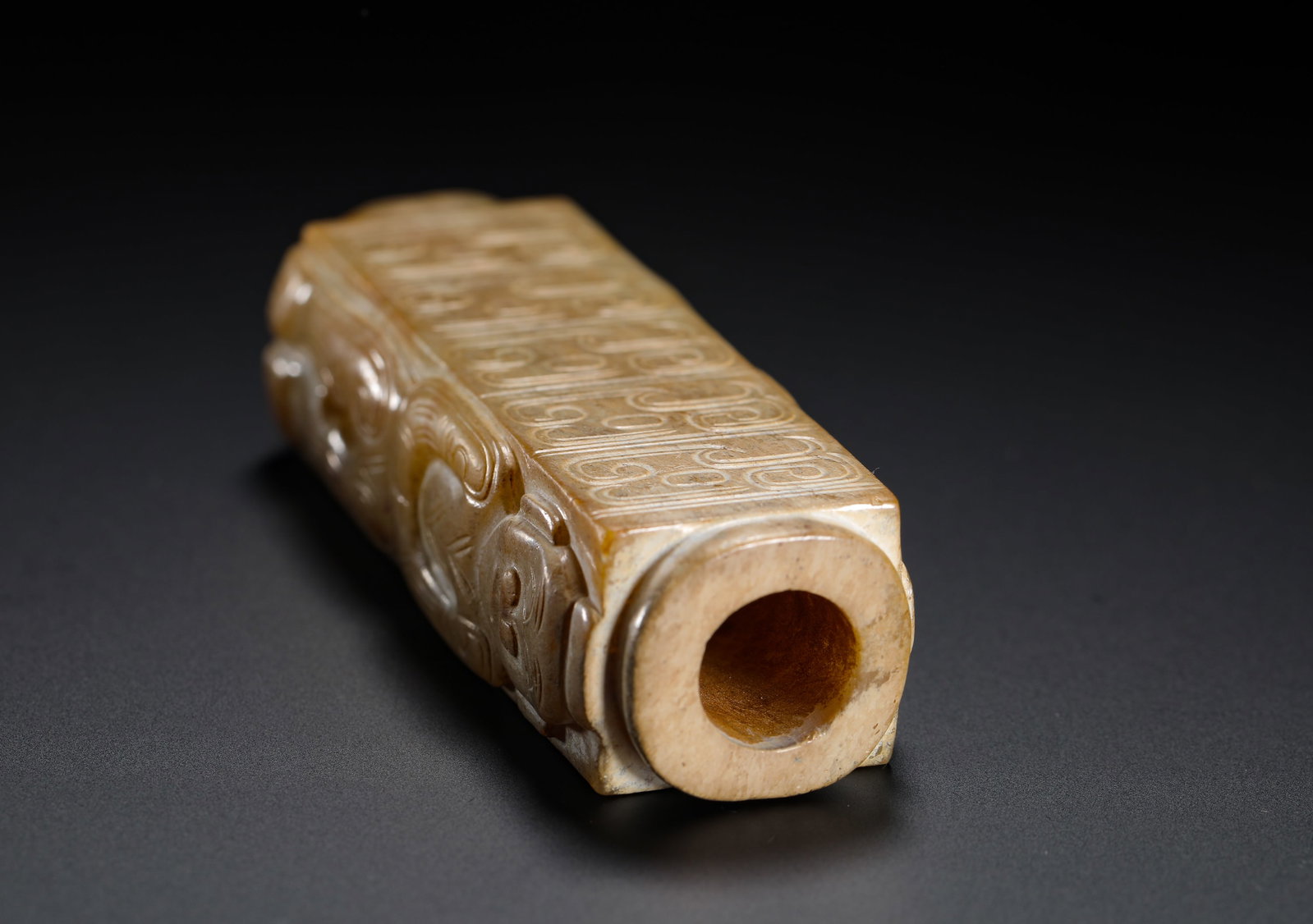 A JADE FIGURE WITH A PATTERNED LEZI - 8