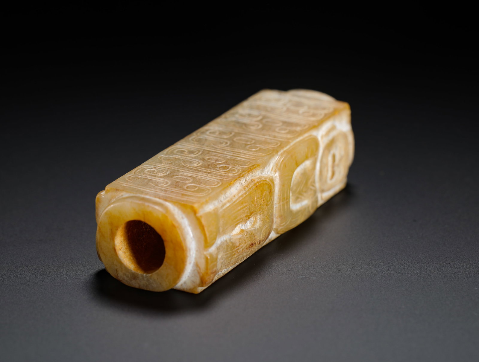 A JADE FIGURE WITH A PATTERNED LEZI - 9