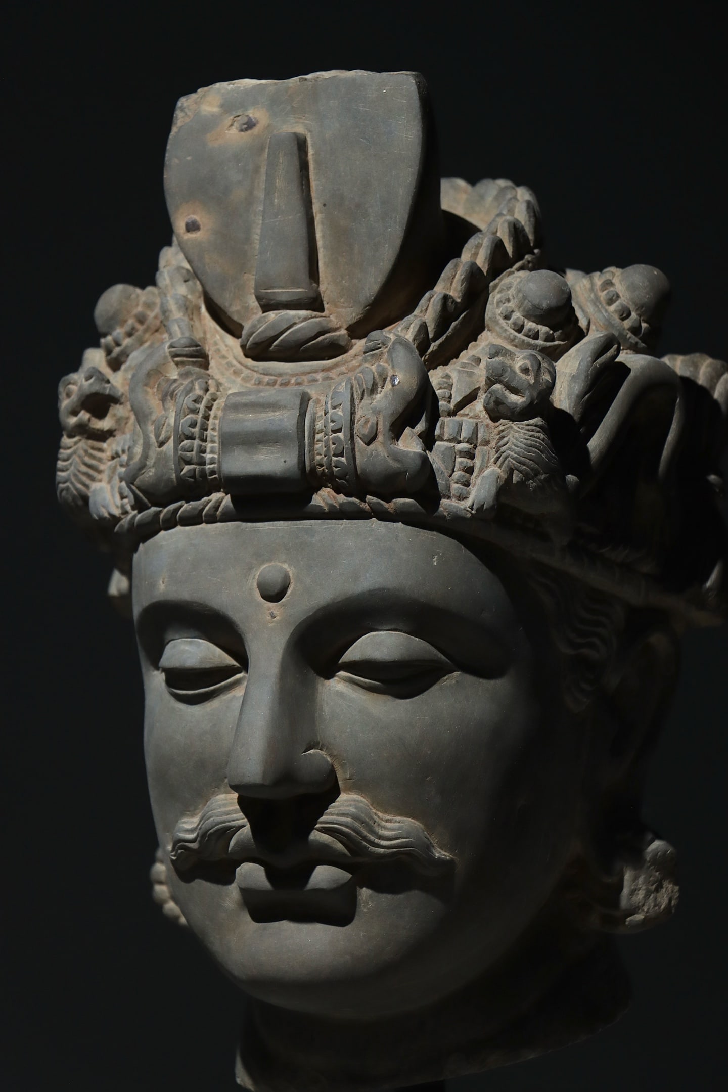A GANDHARA BUDDHA HEAD FROM THE 3RD CENTURY: A GANDHARA BUDDHA HEAD FROM THE 3RD CENTURY (56cm)
