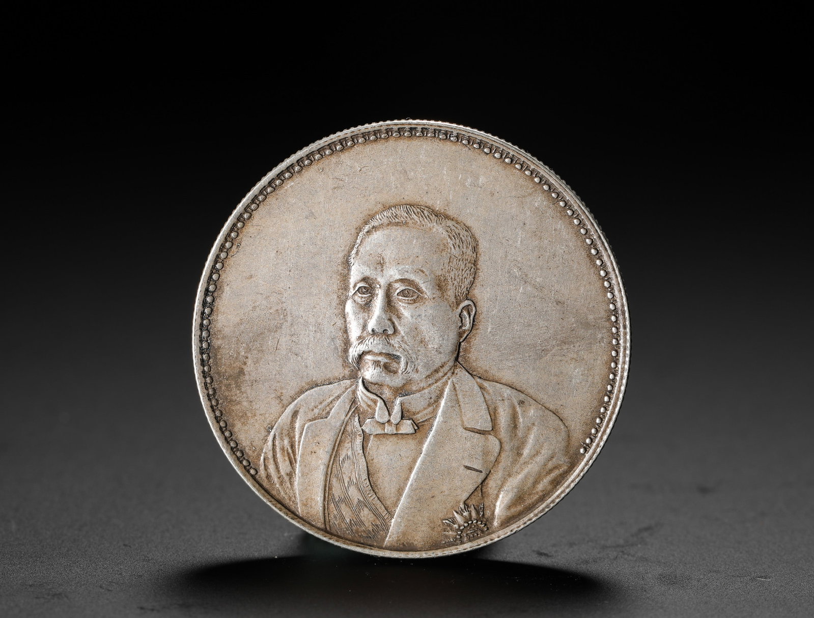 A COMMEMORATIVE SILVER COIN OF XU SHICHANG'S: A COMMEMORATIVE SILVER COIN OF XU SHICHANG'S (3.9cm,Weight:27g)
