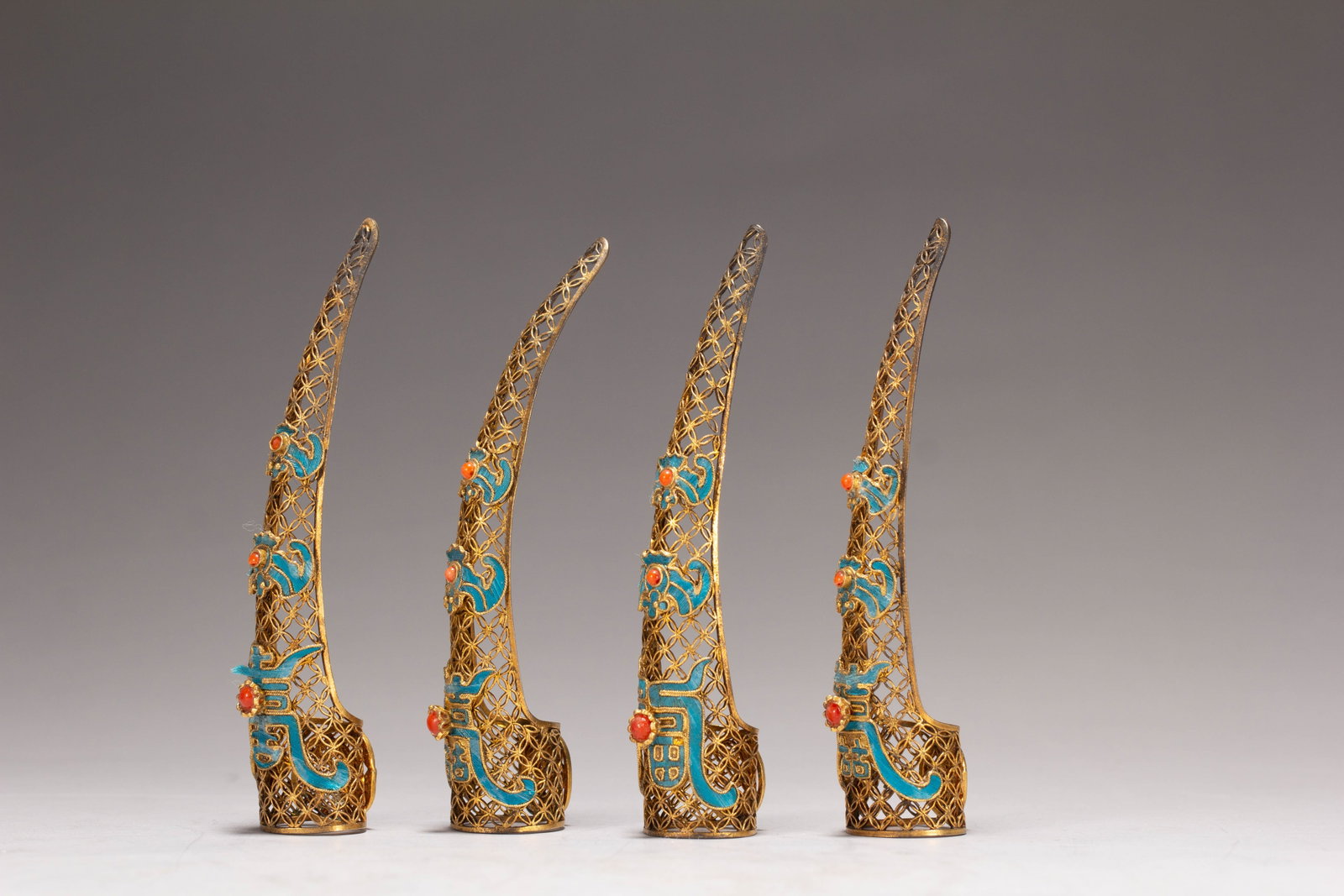 FOUR CHINESE GILT SILVER GEM-SET NAIL GUARDS - 5