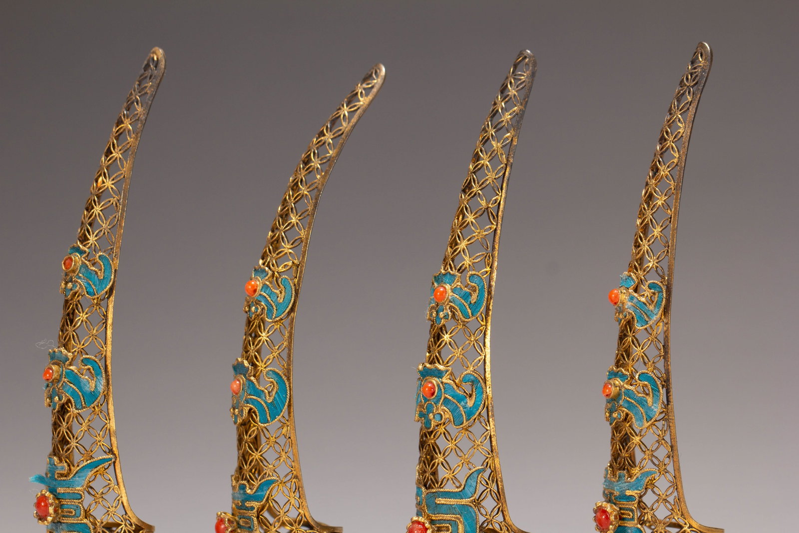 FOUR CHINESE GILT SILVER GEM-SET NAIL GUARDS - 6