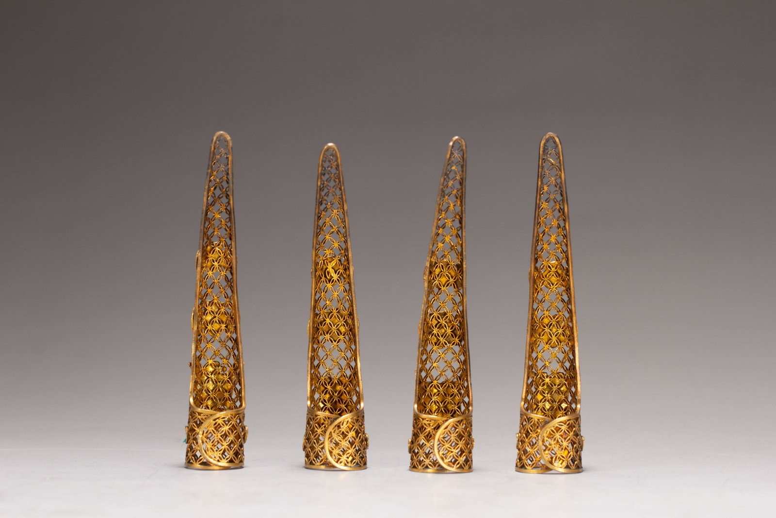 FOUR CHINESE GILT SILVER GEM-SET NAIL GUARDS - 8