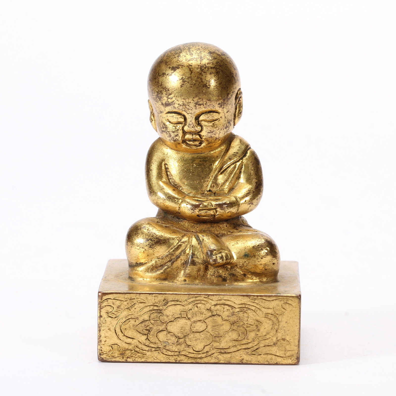 A CHINESE GILT BRONZE MONK SEAL: A CHINESE GILT BRONZE MONK SEAL (4 x 4 x 6.5cm,Weight 300g)