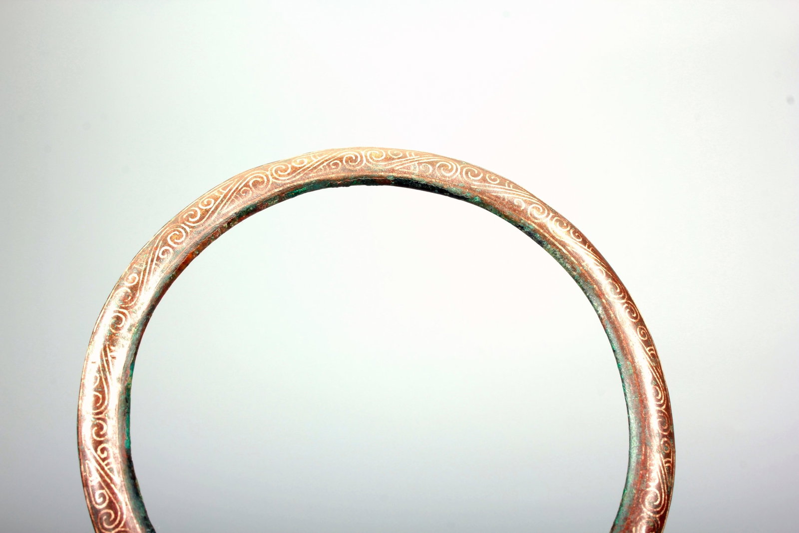 A SILVER-INLAID BRONZE LOOP - 4