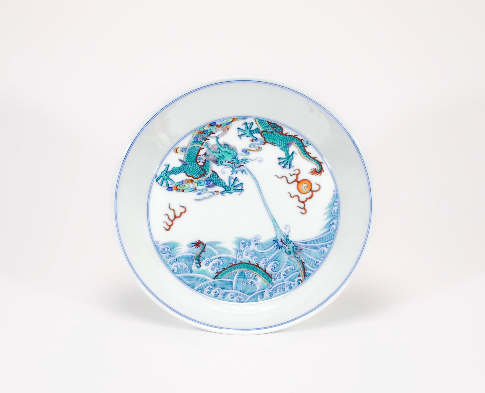 A DOUCAI 'DRAGON INSTRUCTION' DISH: A DOUCAI 'DRAGON INSTRUCTION' DISH Size:Width:22cm,Height:3.5cm