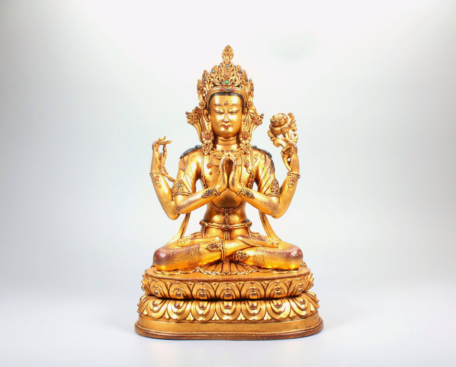 A GILT BRONZE FIGURE OF FOUR-ARMED GUANYIN INLAID WITH GEMS: A GILT BRONZE FIGURE OF FOUR-ARMED GUANYIN INLAID WITH GEMS Size:Height:26.4cm,Width:16.7cm