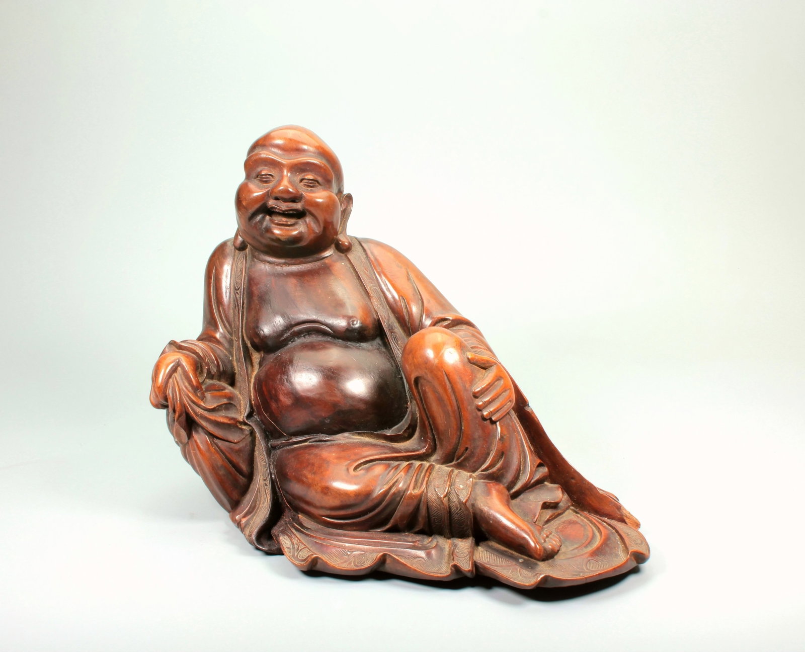A WOOD CARVING FIGURE OF SEATED MAITREYA: A WOOD CARVING FIGURE OF SEATED MAITREYA Size:Height:20cm,Length:15.3cm,Width:27.5m