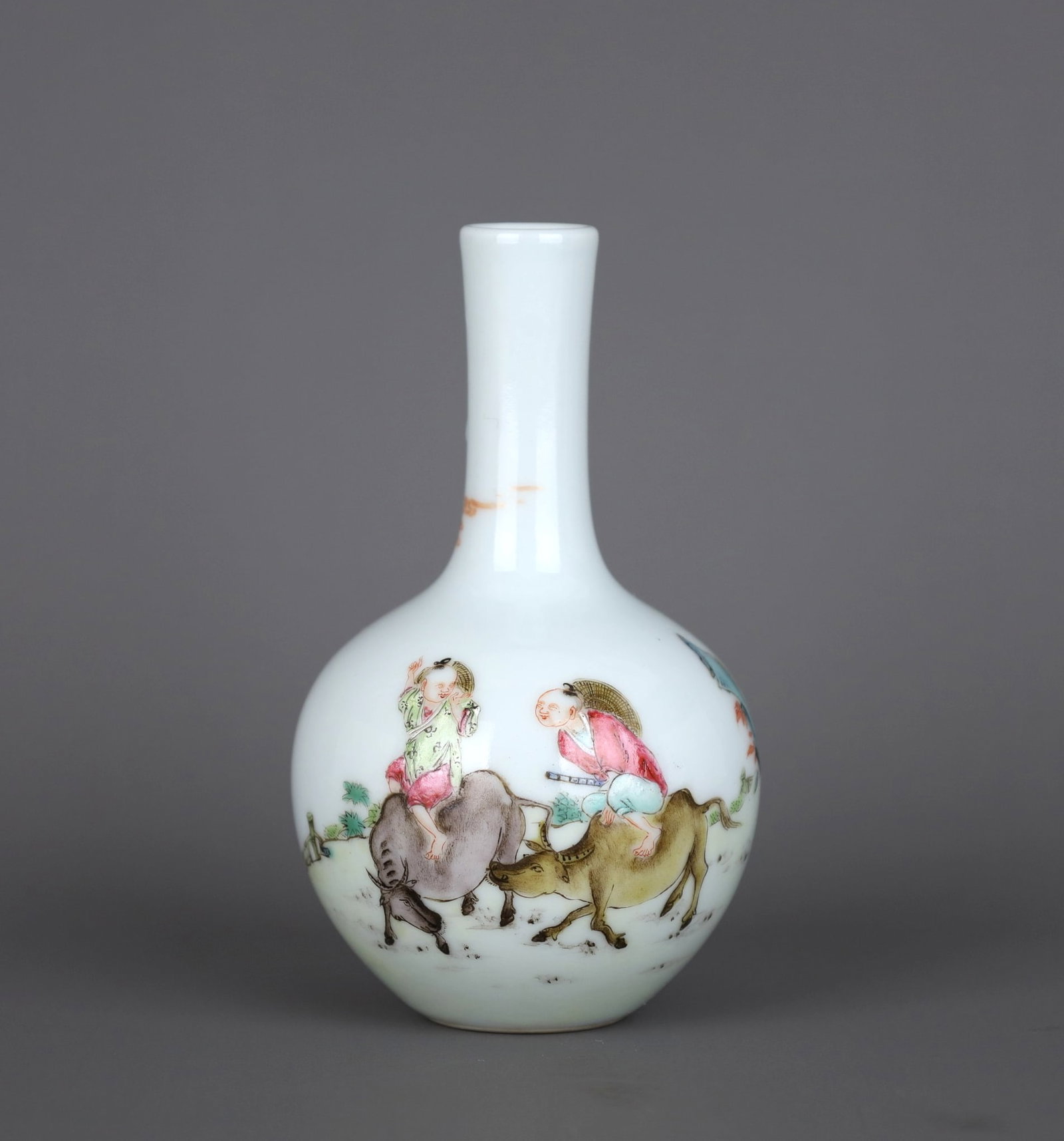 A FAMILLE ROSE 'BOY ON BUFFALO' GLOBULAR VASE: A FAMILLE ROSE 'BOY ON BUFFALO' GLOBULAR VASE Height:10.5cm,Diam:6.2cm