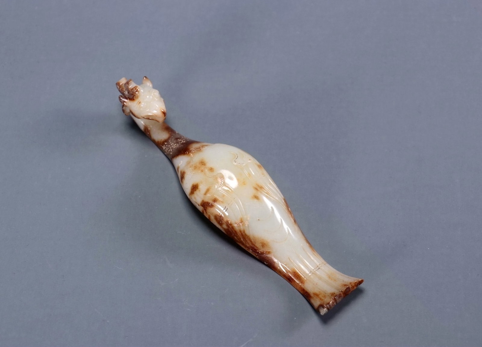 A WARRING STATES / HAN DYNASTY JADE 'PHOENIX' BELT HOOK (1 of 9)