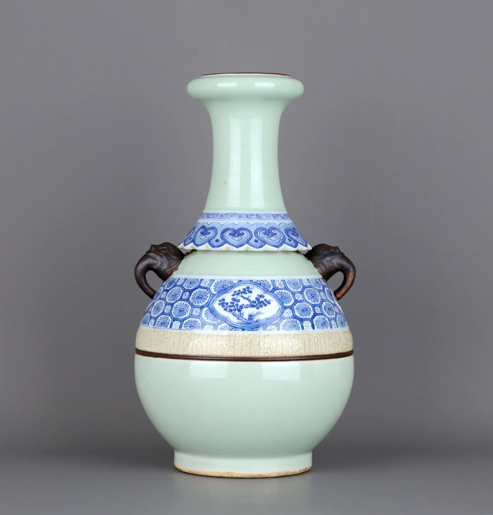 A PALE CELADON-GLAZED BLUE AND WHITE 'FLOWERS' ELEPHANT-HANDLED VASE: A PALE CELADON-GLAZED BLUE AND WHITE 'FLOWERS' ELEPHANT-HANDLED VASE Height:33.2cm,Diam:19.5cm