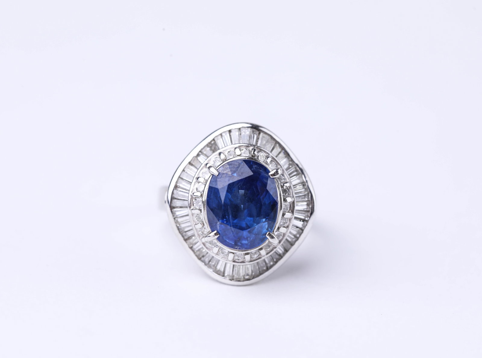 A PLATINUM, SAPPHIRE AND DIAMOND RING (1 of 6)